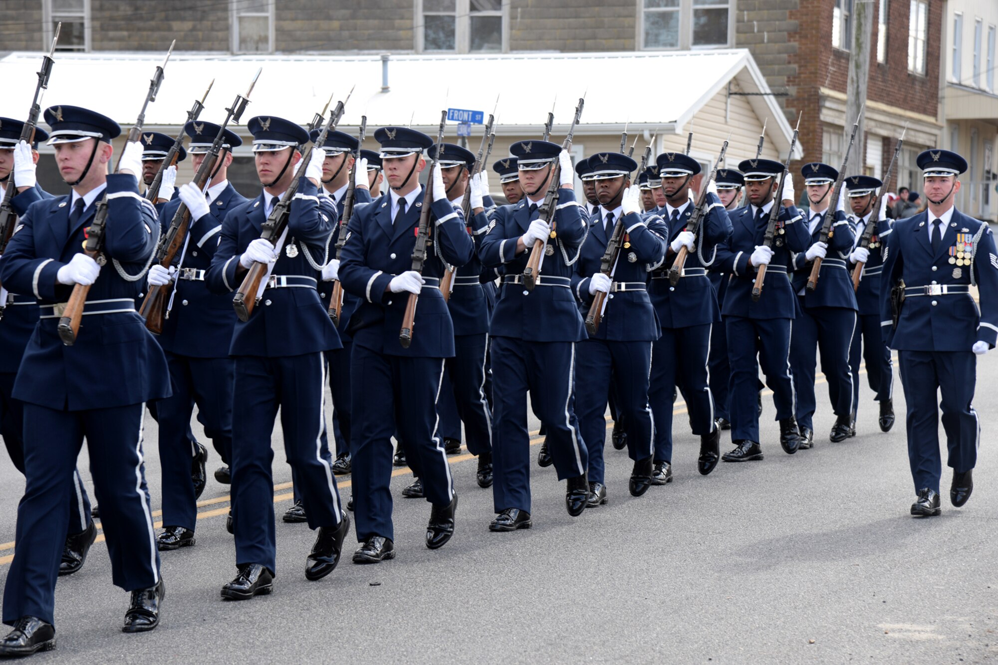 The U.S. Air Force Honor Guard parade element marches in the 3rd Annual Eastern Shore Veterans Day Parade in downtown Laurel, DE., Nov. 14, 2015. Participants in the parade are there to show their support for those who have served and are currently serving in the U.S. Armed Forces. (U.S. Air Force photo/ Staff Sgt. Matt Davis)