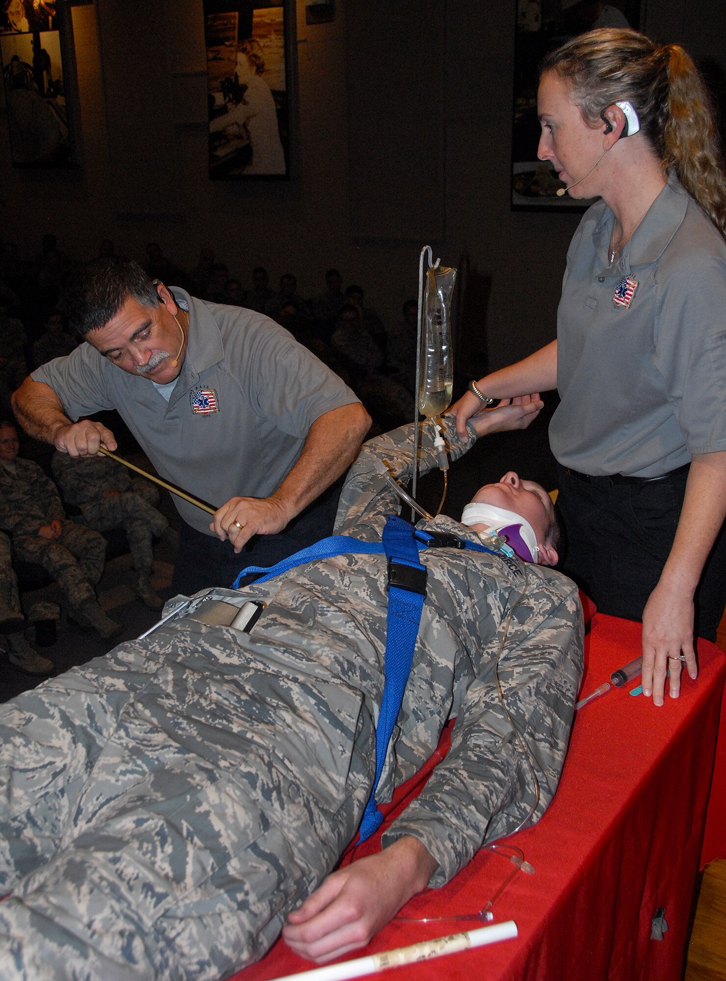 2nd Lt. Cole Finnerty, 96th Logistics Readiness Squadron, has a simulated tube fed into his chest by Sonny Garcia and Natalie Brown, Florida Stay Alive From Education instructors, Nov. 12 at Eglin Air Force Base, Fla.  The demonstration was part of a car accident victim scenario during the “Street Smart” program at the Holiday Traffic Safety Campaign.  (U.S. Air Force photo/Kevin Gaddie)