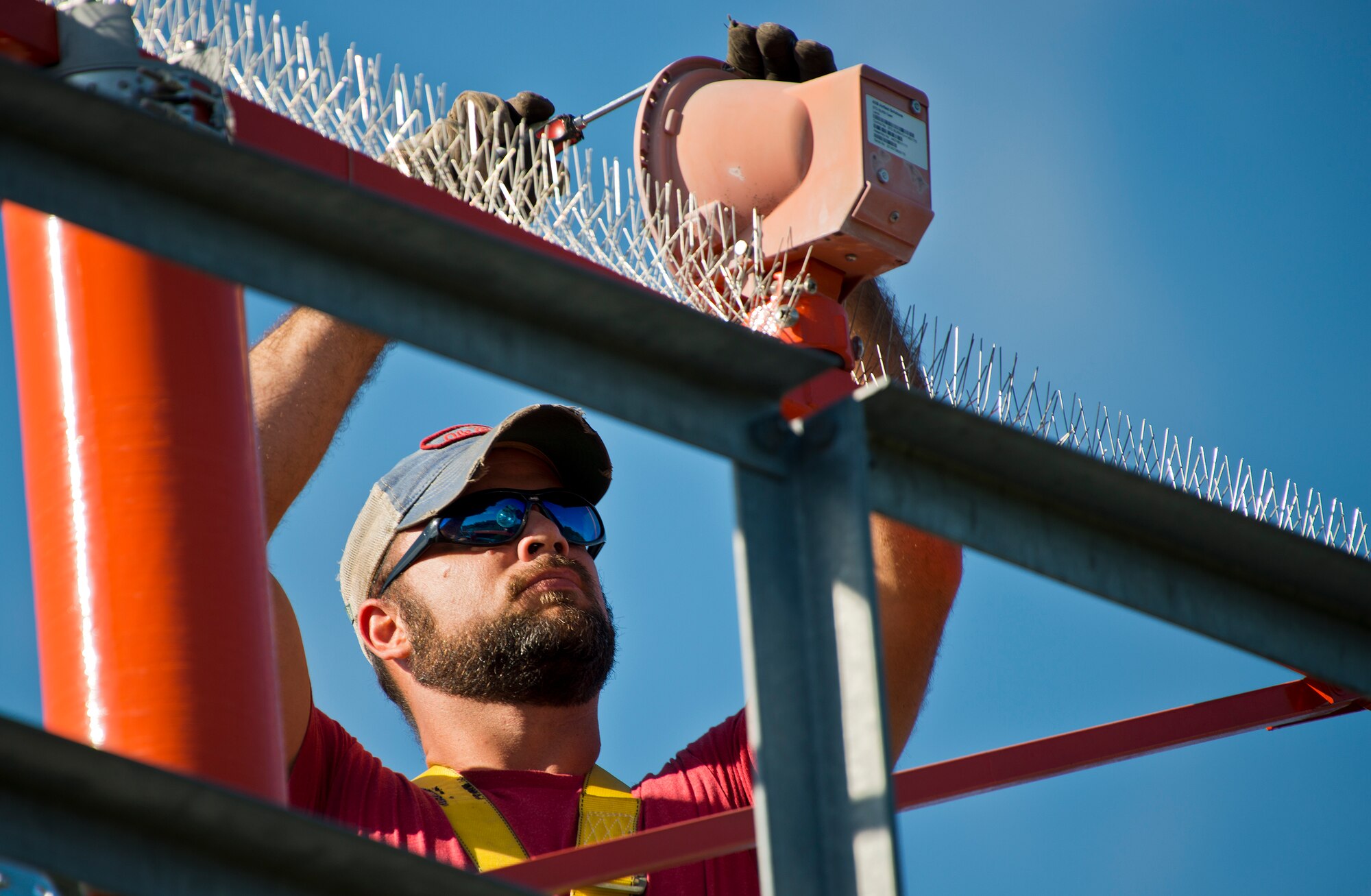 Dusty Dees, 796th Civil Engineer Squadron, changes out a bulb on one of the airfield approach lighting system towers Oct. 29 at Eglin Air Force Base, Fla.  These elevated systems at Eglin and Duke Field are maintained by the 796th CES.  Eglin and Duke’s systems contain 60 elevated towers.   Each contains four 200-watt lamps.  Civil Engineer personnel change out approximately 60 of the 240 lamps used at the top of the spires every year.  (U.S. Air Force photo/Samuel King Jr.)