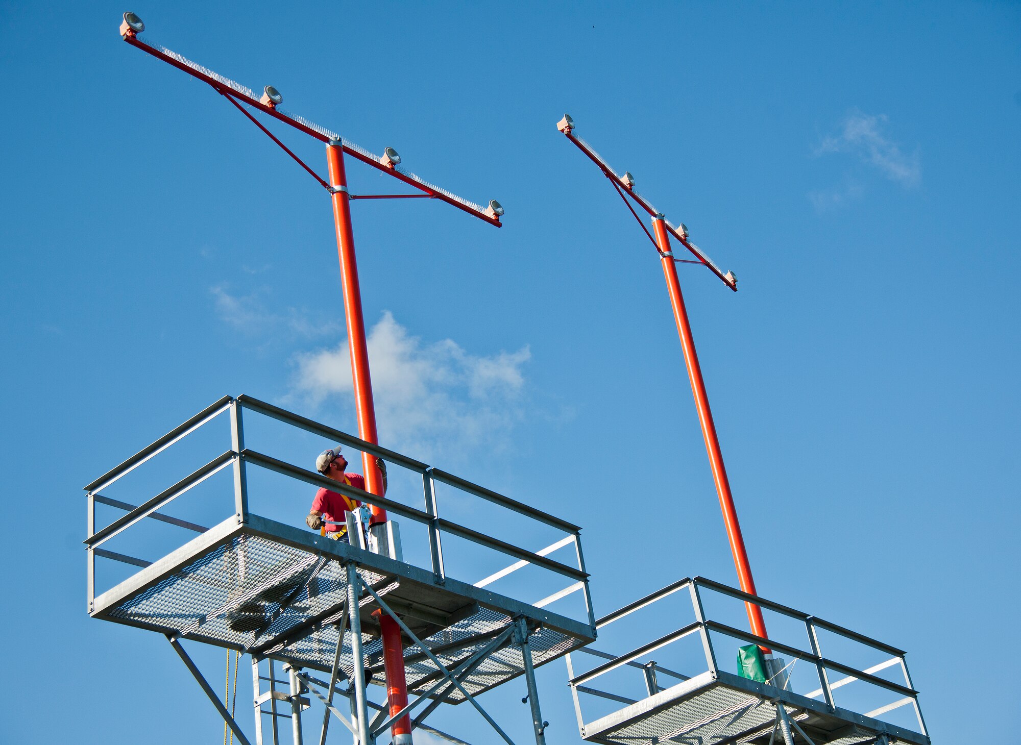 Dusty Dees, 796th Civil Engineer Squadron, uses a crank system to lower an airfield approach lighting spire to change out a lamp Oct. 29 at Eglin Air Force Base, Fla.  These elevated systems at Eglin and Duke Field are maintained by the 796th CES.  Eglin and Duke’s systems contain 60 elevated towers.   Each contains four 200-watt lamps.  Civil Engineer personnel change out approximately 60 of the 240 lamps used at the top of the spires every year.  (U.S. Air Force photo/Samuel King Jr.)