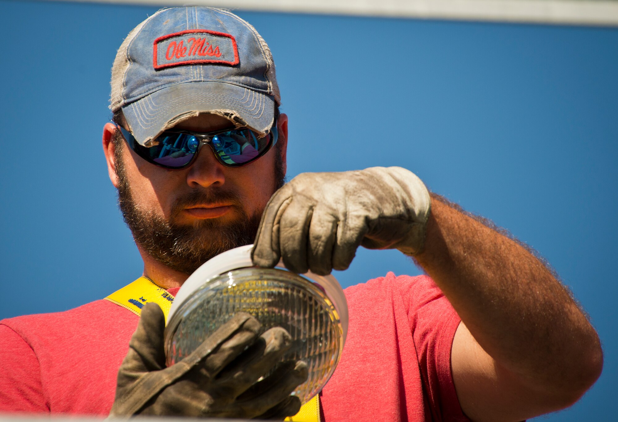 Dusty Dees, 796th Civil Engineer Squadron, prepares a new bulb prior to connecting it to the airfield approach lighting system tower Oct. 29 at Eglin Air Force Base, Fla.  These elevated systems at Eglin and Duke Field are maintained by the 796th CES.  Eglin and Duke’s systems contain 60 elevated towers.   Each contains four 200-watt lamps.  Civil Engineer personnel change out approximately 60 of the 240 lamps used at the top of the spires every year.  (U.S. Air Force photo/Samuel King Jr.)