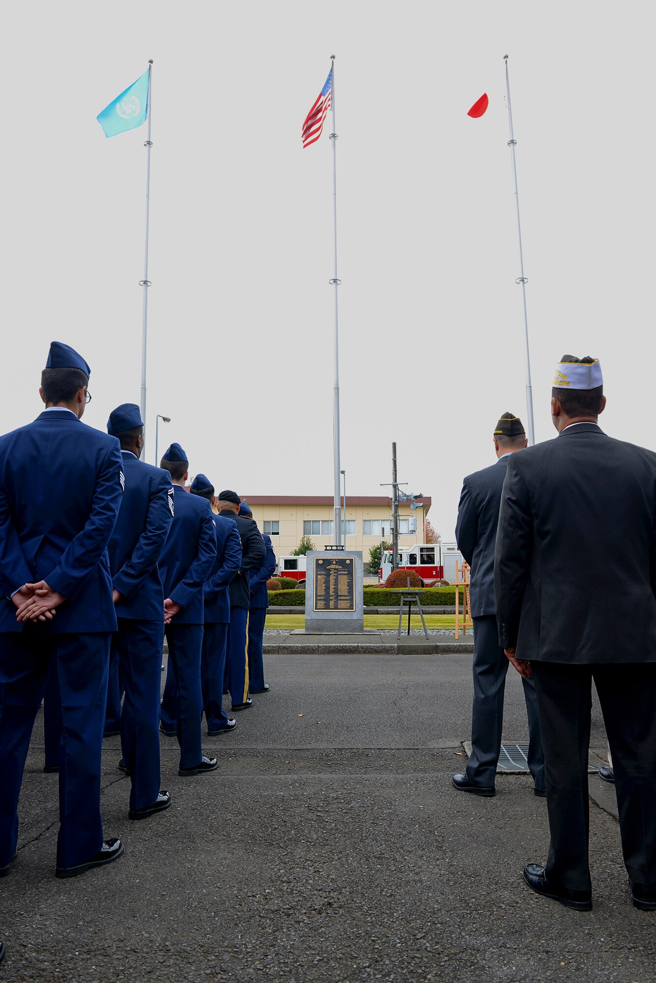 Service members stand in formation during a Veterans Day ceremony at Yokota Air Base, Japan, Nov. 11, 2015. Veterans Day celebrates the service of all U.S. military veterans and coincides with Armistice Day and Remembrance Day which are celebrated in other countries, marking the anniversary of the end of World War I. (U.S. Air Force photo by Senior Airman David C. Danford/Released)