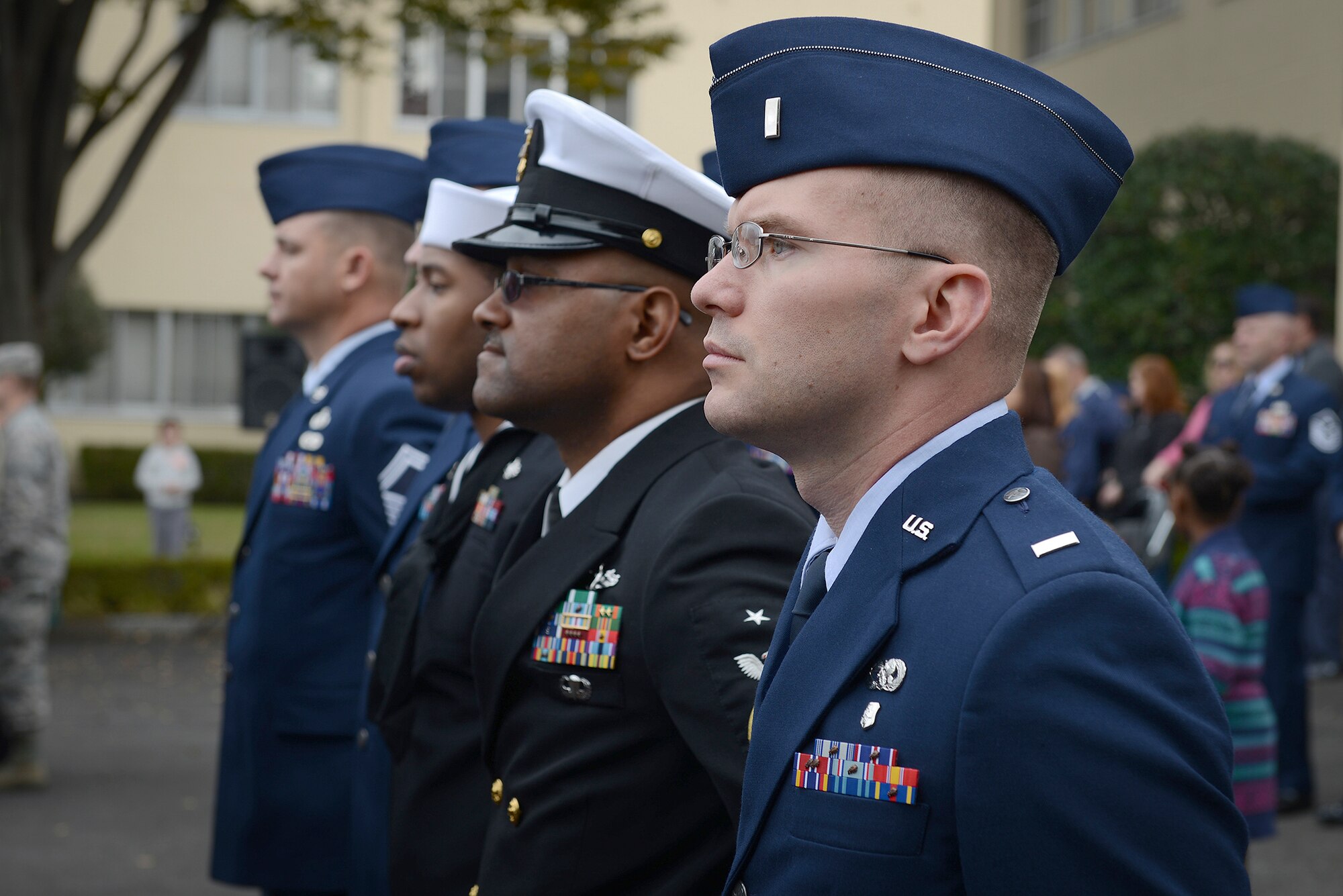 Service members stand in formation during a Veterans Day ceremony at Yokota Air Base, Japan, Nov. 11, 2015. Veterans Day celebrates the service of all U.S. military veterans and coincides with Armistice Day and Remembrance Day which are celebrated in other countries, marking the anniversary of the end of World War I. (U.S. Air Force photo by Senior Airman David C. Danford/Released)