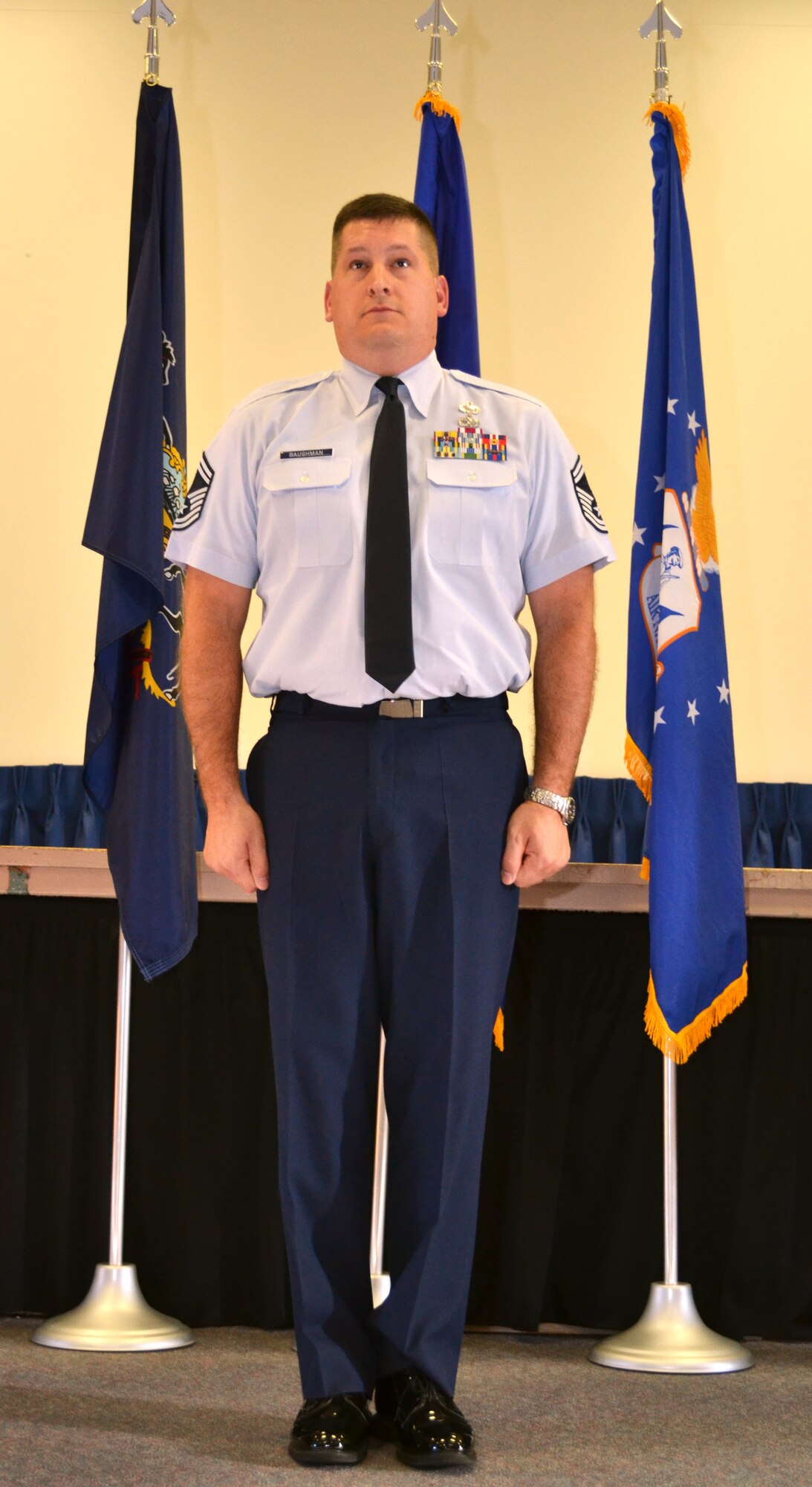Senior Master Sgt. Scot Baughman, of the 111th Force Support Squadron, stands as attention as he is promoted to the rank of chief master sergeant during a ceremony held at Horsham Air Guard Station, Nov. 16, 2015. Maj. Brian Wilson, the commander of the 111th FSS spoke on behalf of both Guardsman during the event that occurred during November’s unit training assembly. (U.S. Air National Guard photo by Tech. Sgt. Andria Allmond)
