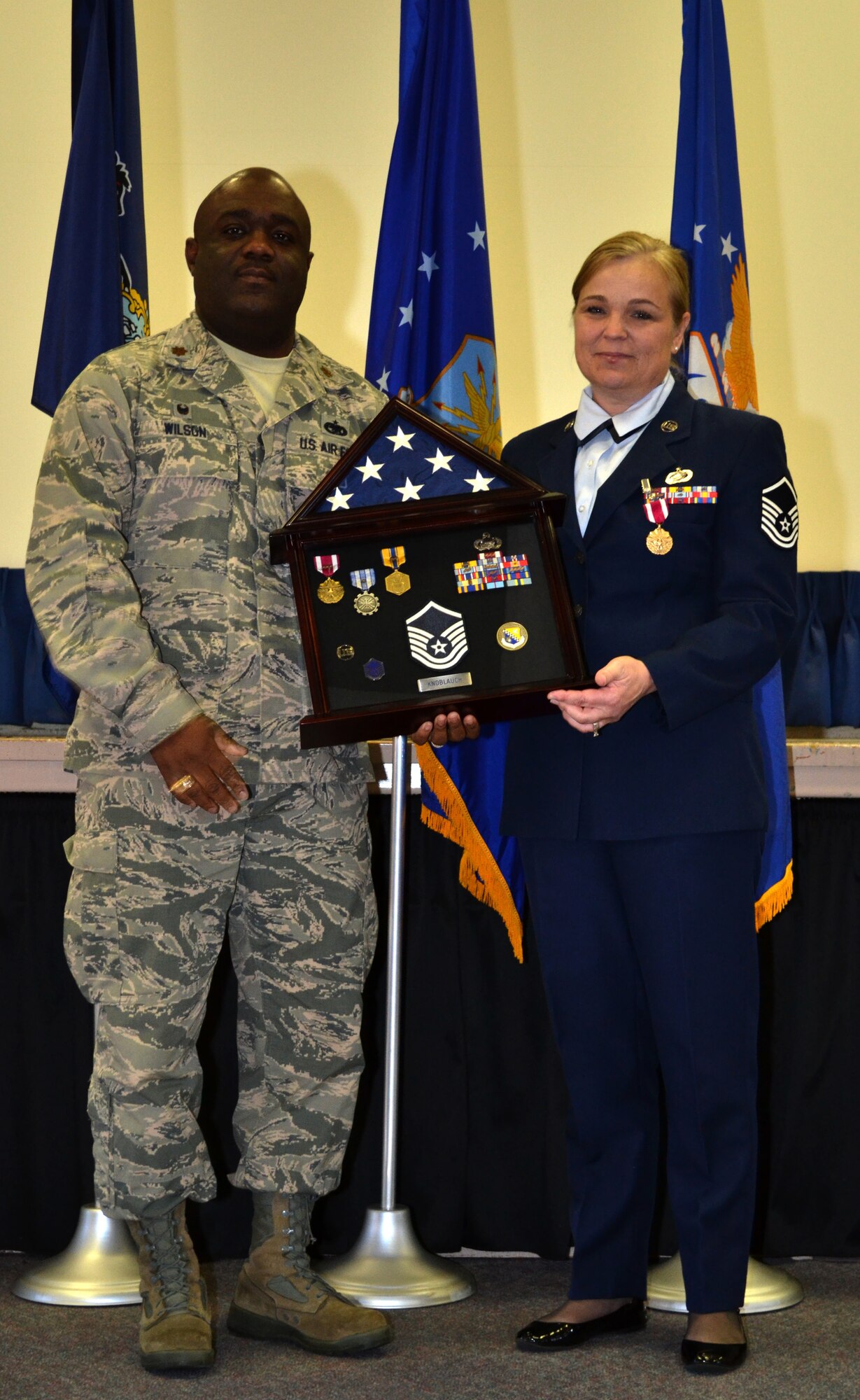 Master Sgt. Lisa Luckenbach, a personnel readiness technician from the 111th Force Support Squadron, stands by Maj. Brian Wilson, the commander of the 111th FSS, during her retirement ceremony held at Horsham Air Guard Station, Nov. 16, 2015.  Wilson spoke on behalf of the Guardsman during the event that occurred during November’s unit training assembly. (U.S. Air National Guard photo by Tech. Sgt. Andria Allmond/Released)
