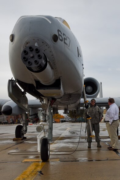 Kevin Miller of KIDO radio in Boise, speaks to 124th Maintenance Group, Crew Chief, Master Sgt. Alan Stoker about the A-10 Thunderbolt II after the broadcast of his morning show from the 124th Fighter Wing, Boise, Idaho on Nov. 10, 2015. Miller spoke with six members of the Idaho Air National Guard on the show about their experiences in the National Guard, work-life balance, and the greater mission and future of the 124th Fighter Wing.   (Air National Guard photo by Tech. Sgt. Sarah Pokorney/Released)