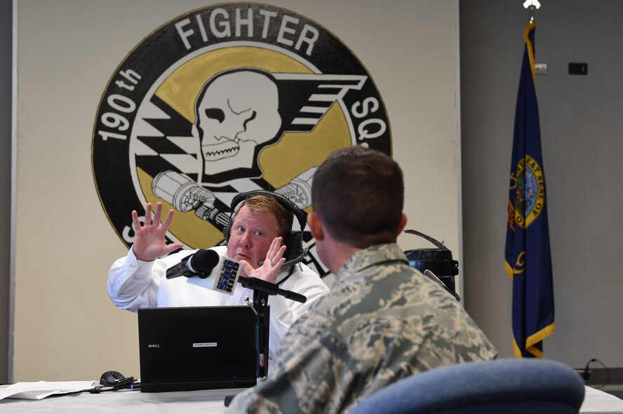 Kevin Miller of KIDO radio in Boise, interviews Major Chris Borders, Idaho National Guard public affairs officer, during the broadcast of his morning talk show on Nov. 10, 2015 from the 124th Fighter Wing, Boise, Idaho. Miller spoke with six members of the Idaho Air National Guard about their experiences in the National Guard, work and life balance, and the greater mission and future of the 124th Fighter Wing.   (Air National Guard photo by Tech. Sgt. Sarah Pokorney/Released)