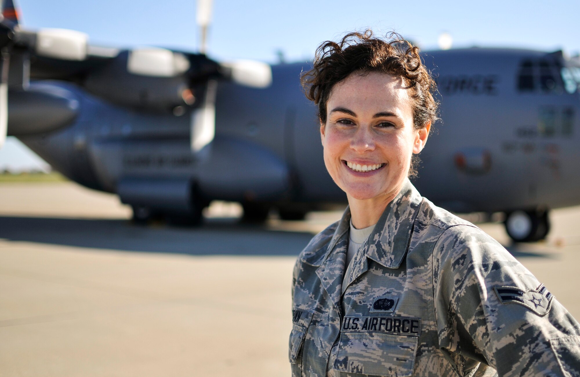 U.S. Air Force Airman 1st Class Tanya L. Brown, a services journeyman with the 182nd Force Support Squadron, Illinois Air National Guard, poses on the 182nd Airlift Wing aircraft apron in Peoria, Ill., Nov. 7, 2015. Brown – a full-time beautician, farmer, student, wife and mother - enlisted in the Air National Guard at the age of 35. (U.S. Air National Guard photo by Staff Sgt. Lealan Buehrer/Released)