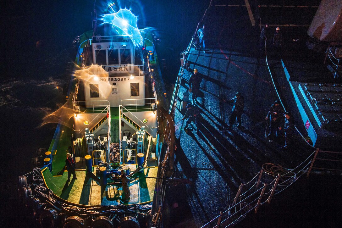 U.S. sailors cast off lines to a tug while getting underway from Commander Fleet Activities Sasebo in Sasebo Harbor, Japan,  Nov. 13, 2015. The sailors are assigned to the USS Stethem, which is patrolling the 7th Fleet area of operation to support security and stability in the Indo-Asia-Pacific. U.S. Navy photo by Petty Officeer 2nd Class Kevin V. Cunningham

