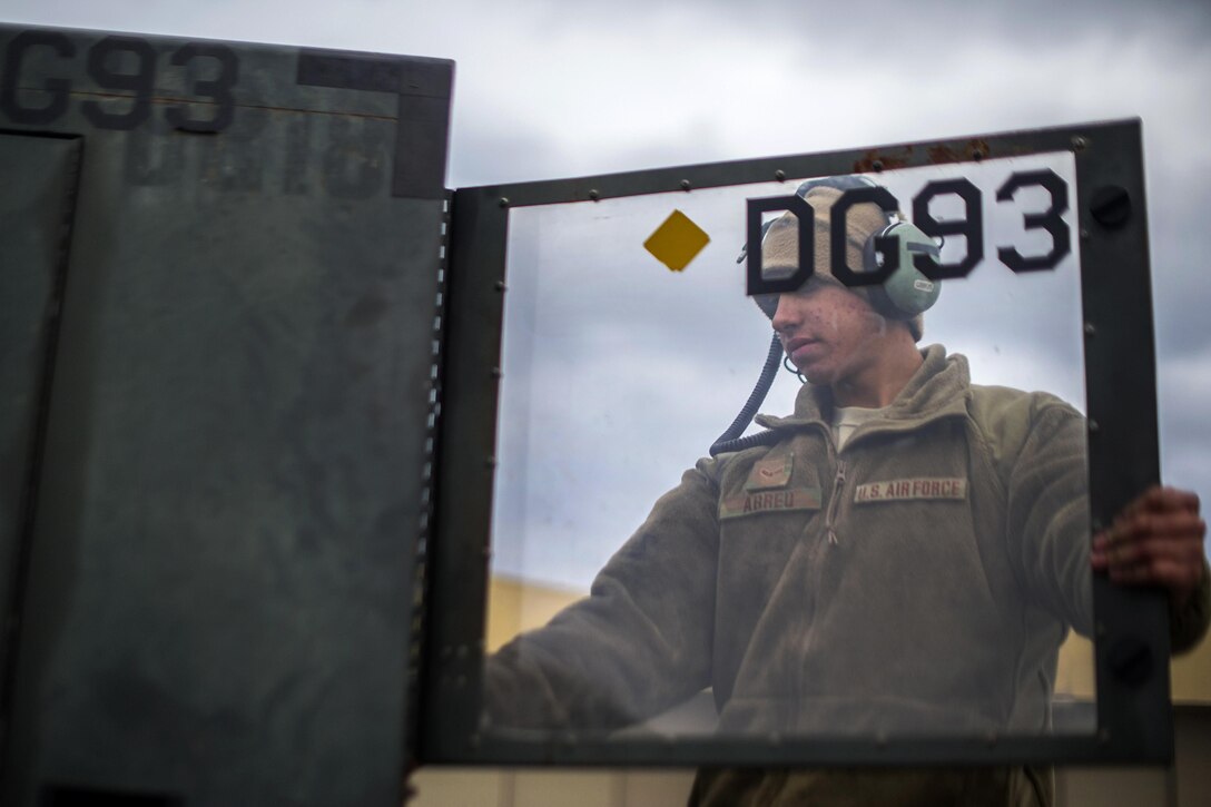 U.S. Air Force Airman 1st Class Michael Abreu powers on a generator to test an air conditioning unit on a C-130 Hercules aircraft on Bagram Airfield, Afghanistan, Nov. 11, 2015. Abreu is an electrical and environmental systems technician assigned to the 455th Expeditionary Aircraft Maintenance Squadron. U.S. Air Force photo by Tech. Sgt. Robert Cloys