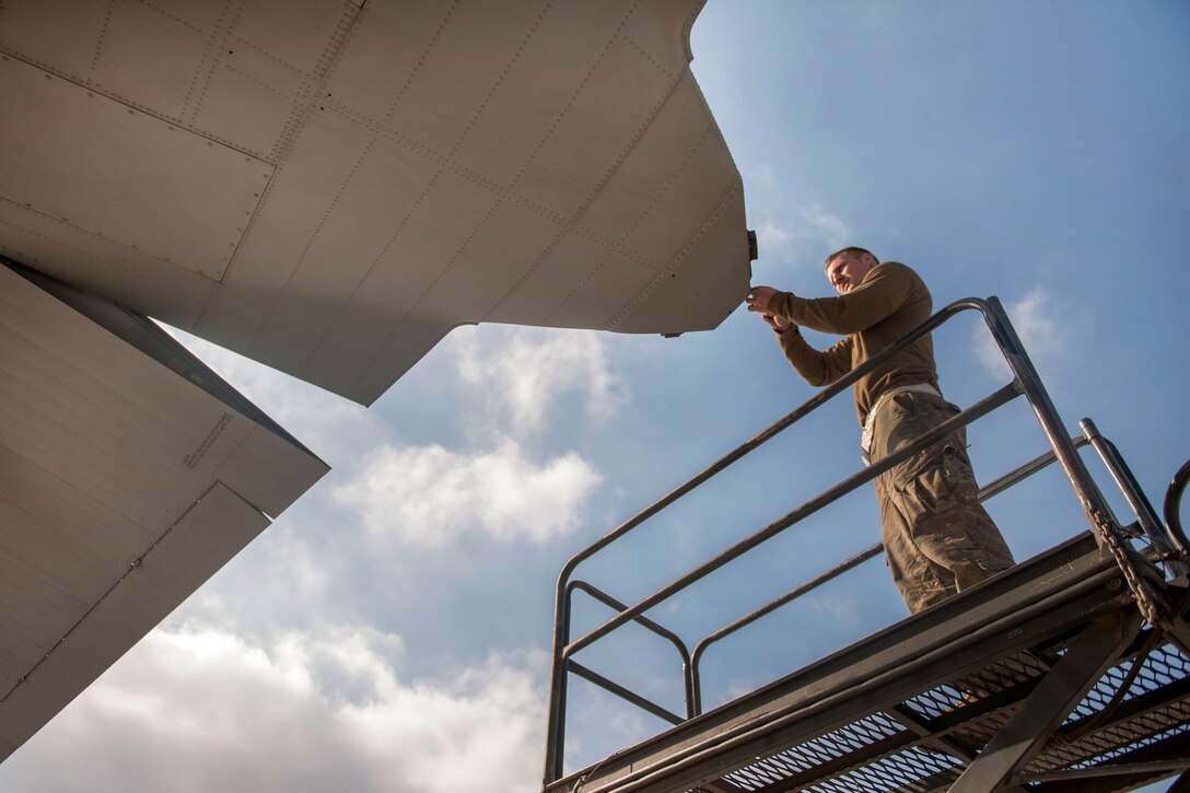 U.S. Air Force Senior Airman Nick Orchard replaces a navigation light on a C-130 Hercules aircraft on Bagram Airfield, Afghanistan, Nov. 13, 2015. Orchard is a crew chief assigned to the 455th Expeditionary Aircraft Maintenance Squadron. U.S. Air Force photo by Tech. Sgt. Robert Cloys
