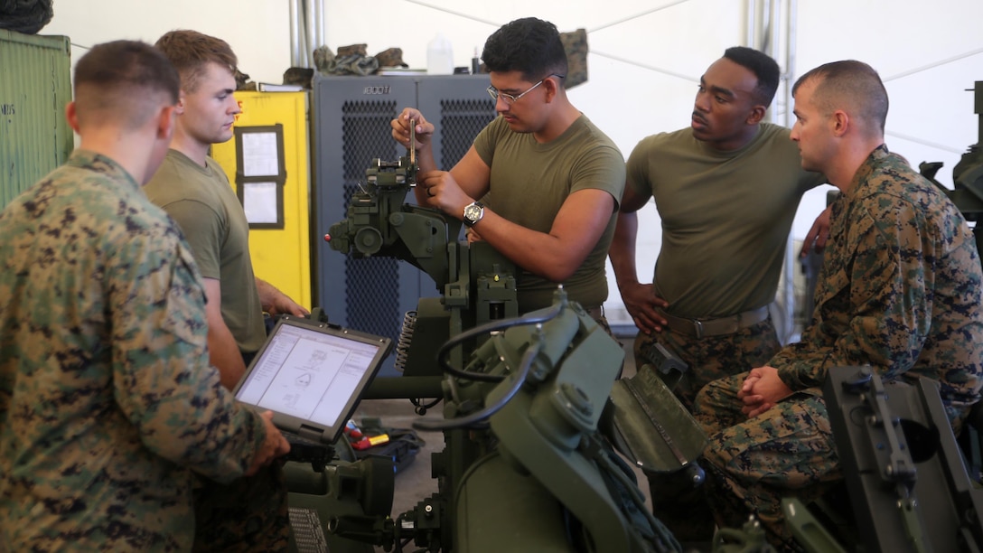 Lance Corporal Eli Guevara, a field artillery cannoneer with 2nd Battalion, 10th Marine Regiment, learns the functions of a gunner’s quadrant during the Artillery Assistant Gunners and Gunners Course Nov. 6, 2015, at Marine Corps Base Camp Lejeune, N.C. The month-long course trains Marines to transition from basic field artillery cannoneers to assistant gunners and gunners within their gun sections. 