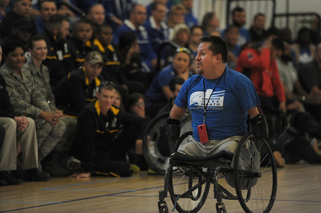 Bob Lujano, president of U.S. Quad Rugby Association, addresses the audience during the opening ceremony of the Joint Services Wheelchair Rugby Exhibition tournament during Warrior Care Month 2015 on Joint Base Andrews, Md., Nov. 16, 2015. DoD photo by Marvin Lynchard