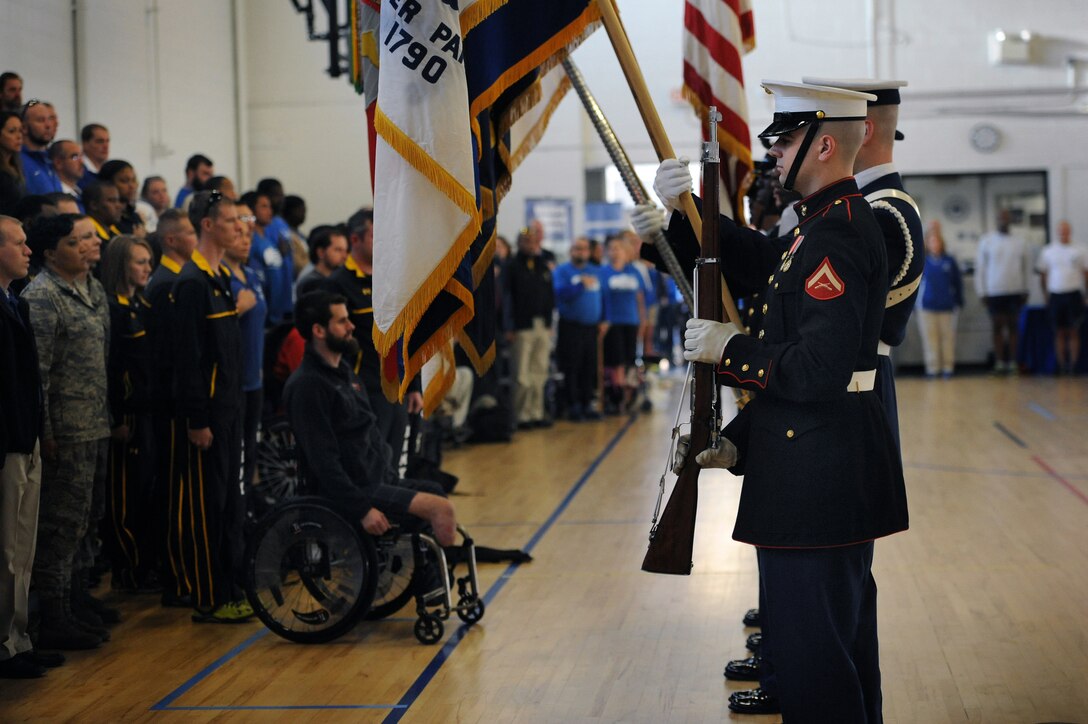 Army Honor Guard soldiers assigned to the 3rd U.S. Infantry Regiment, known as "The Old Guard," post the colors during the opening ceremony of the Joint Services Wheelchair Rugby Exhibition tournament during Warrior Care Month 2015 on Joint Base Andrews, Md., Nov. 16, 2015. DoD photo by Marvin Lynchard