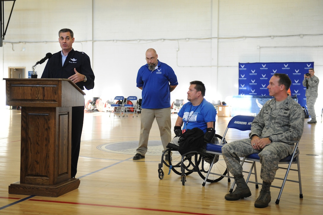 Bob Lujano, president of U.S. Quad Rugby Association, addresses the audience during the opening ceremony of the Joint Services Wheelchair Rugby Exhibition tournament during  Warrior Care Month 2015 on Joint Base Andrews, Md., Nov. 16, 2015. DoD photo by Marvin Lynchard