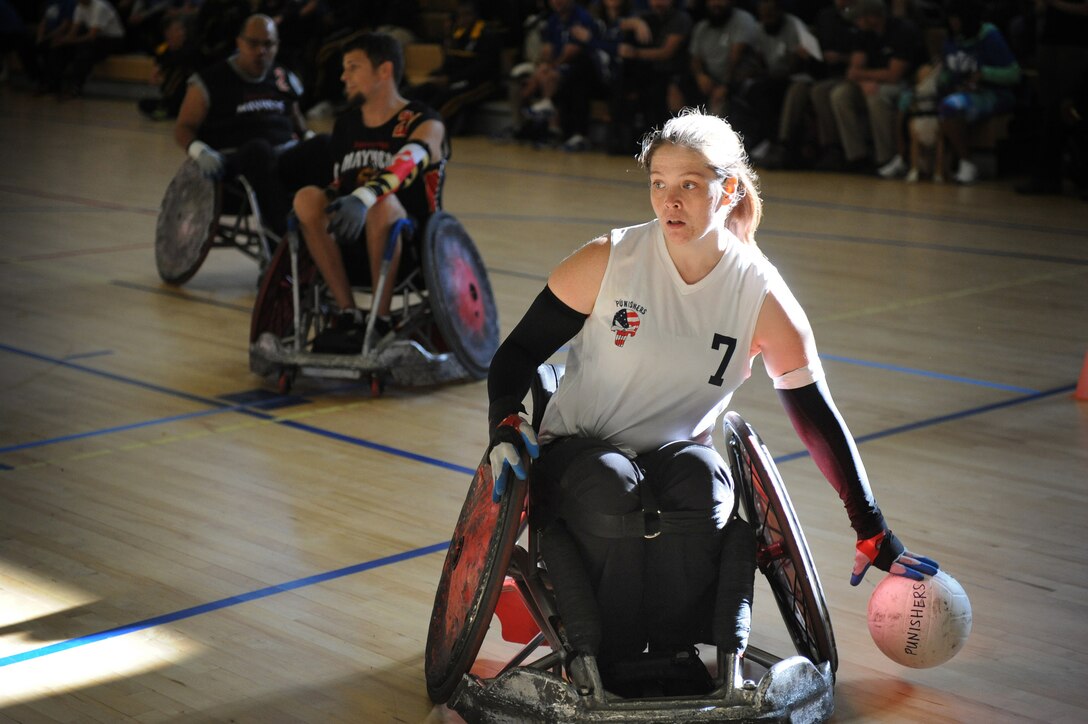 Cory Harrower, a member of the Canadian National Wheelchair Rugby Team, performs with the Capital Punishers Quad Rugby team as the Punishers do battle with the Maryland Mayhem during an exhibition match at the Joint Services Wheelchair Rugby Exhibition during Warrior Care Month 2015 on Joint Base Andrews, Md., Nov. 16, 2015. DoD photo by Marvin Lynchard