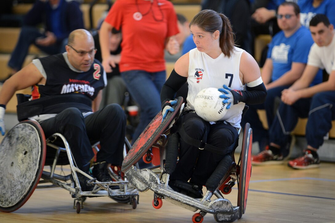 Cory Harrower, right, a member of the Canadian National Wheelchair Rugby Team, performs with the Capital Punishers Quad Rugby team as the Punishers do battle with the Maryland Mayhem during an exhibition match at the Joint Services Wheelchair Rugby Exhibition during Warrior Care Month 2015 on Joint Base Andrews, Md., Nov. 16, 2015. DoD photo by Marvin Lynchard
