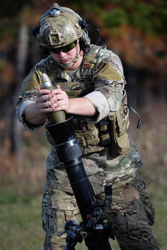 An Army Green Beret prepares to fire a mortar system at training targets during Southern Strike 16 on Camp Shelby Joint Forces Training Center, Miss., Nov. 4, 2015. The Green Beret is assigned to Company C, 2nd Battalion, 20th Special Forces Group. New York Air National Guard photo by Staff Sgt. Christopher S. Muncy