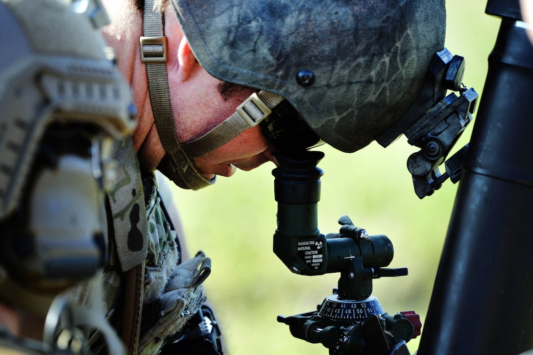 An Army Green Beret sights in a mortar system during Southern Strike 16 on Camp Shelby Joint Forces Training Center, Miss., Nov. 4, 2015. The Green Beret is assigned to Company C, 2nd Battalion, 20th Special Forces Group. New York Air National Guard photo by Staff Sgt. Christopher S. Muncy