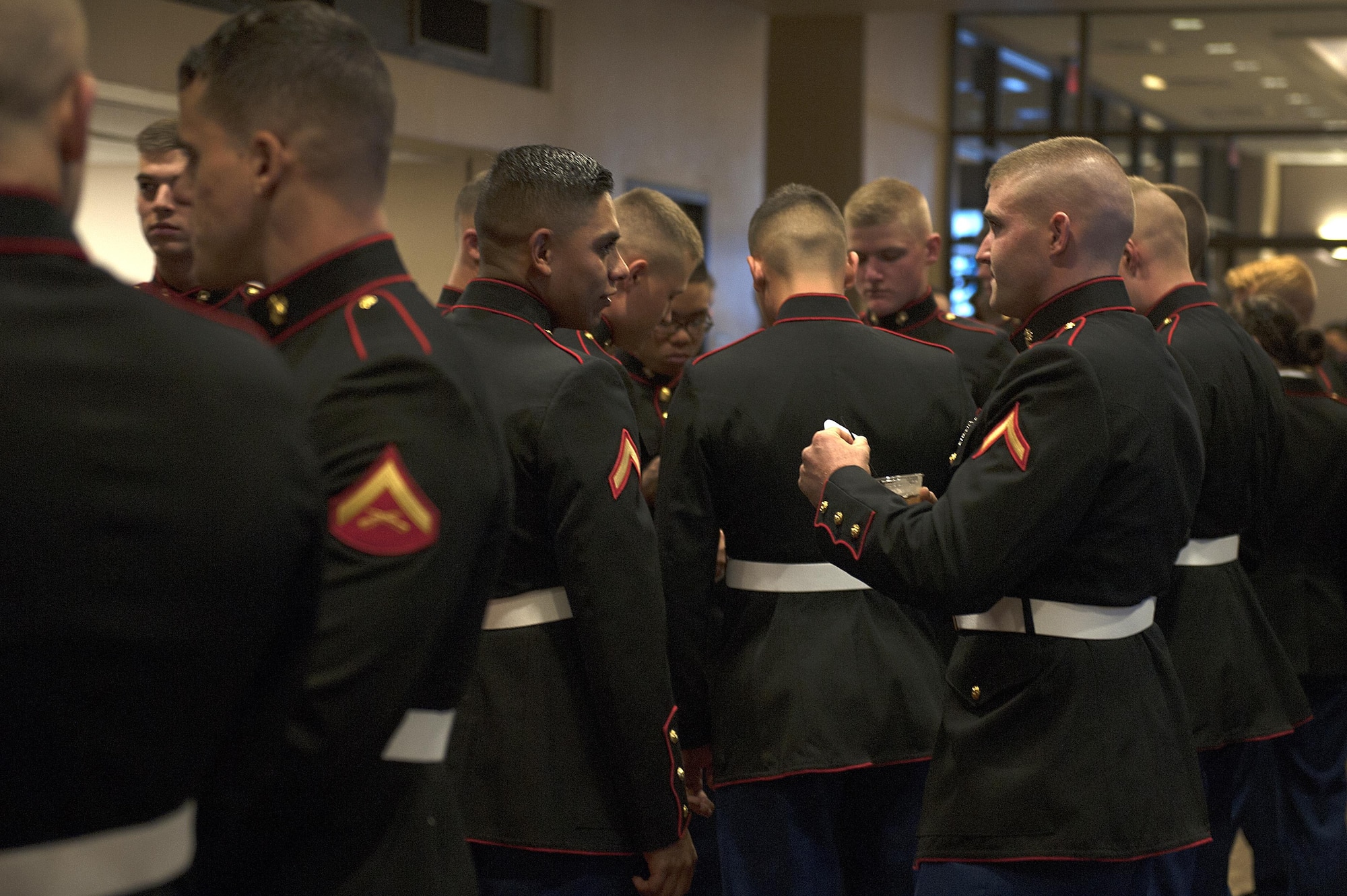 Marines converse during the Unites State Marine Corps Ball social hour at the the McNease Convention Center, San Angelo, Texas, Nov. 14, 2015. The ball celebrated the 240th birthday of the Marine Corps and honored past and present Marines. (U.S. Air Force photo by Airman 1st Class Caelynn Ferguson/Released)