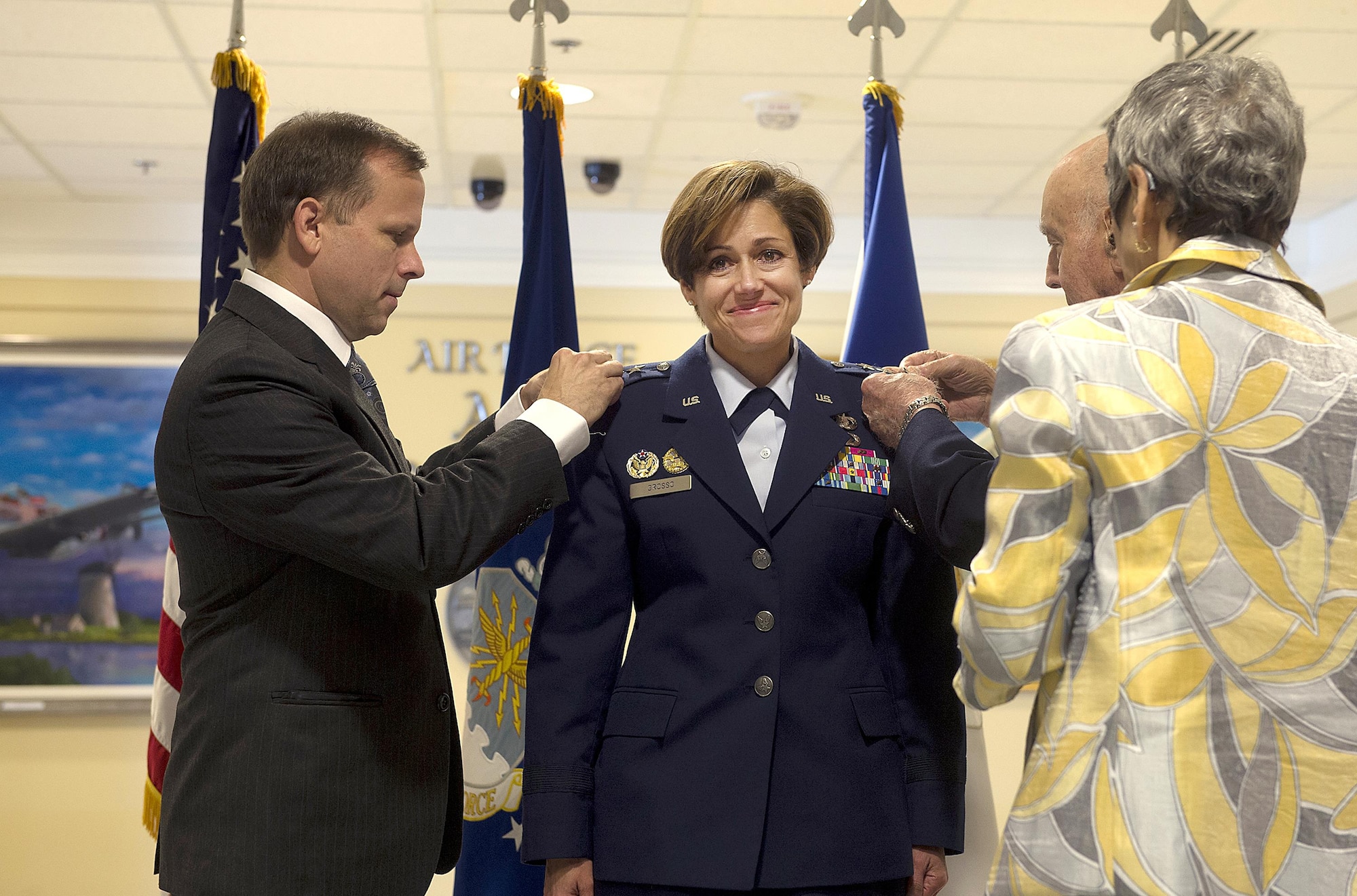 Retired Air Force Col. Brian O'Connor, Dr. Camille Grosso, and retired Air Force Lt. Col. Gerry Grosso help pin Lt. Gen. Gina Grosso's new rank during her promotion ceremony in the Pentagon, Nov. 16, 2015. Grosso is the 31st Airman to serve as the Air Force's deputy chief of staff for manpower, personnel and services in the 47 years of the position's existence.  (U.S. Air Force photo/Jim Varhegyi)