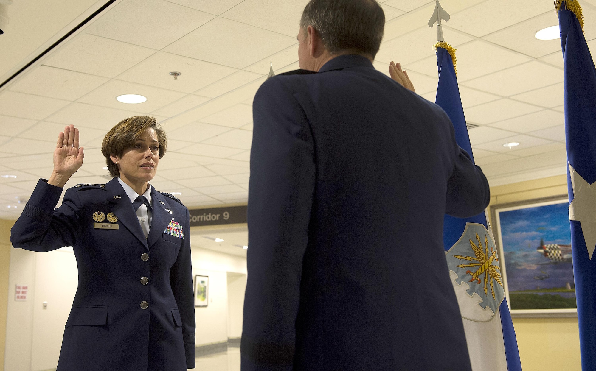 Air Force Vice Chief of Staff Gen. David L. Goldfein, right, gives the oath of office to Lt. Gen. Gina Grosso during her promotion ceremony in the Pentagon, Nov. 16, 2015. Grosso is the 31st Airman to serve as the Air Force's deputy chief of staff for manpower, personnel and services in the 47 years of the position's existence. (U.S. Air Force photo/Jim Varhegyi)