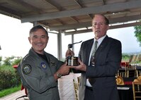 CAMP H.M. SMITH (Nov. 13, 2015) Adm. Harry B. Harris Jr., commander of U.S. Pacific Command, receives the Gray Owl award from retired Navy Capt. Brick Nelson, a Northrop Grumman Corporate Lead Executive from San Diego, Calif. The Gray Owl award is sponsored by Northrop Grumman Corp. and is awarded to the Naval Flight Officer with the longest period of active duty service. (U.S. Army photo by Staff Sgt. Charlene Moler/Released) 
