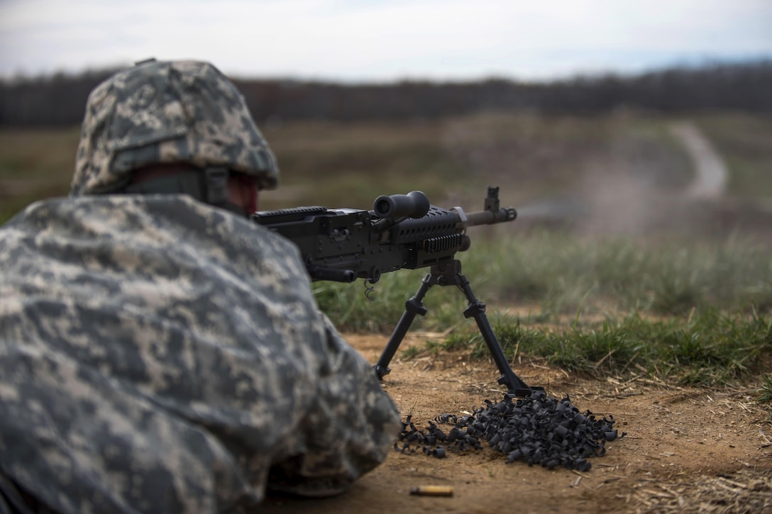 A soldier shoots an M240B machine gun during a qualification range event on Camp Atterbury, Ind., Nov. 6, 2015. U.S. Army photo by Master Sgt. Michel Sauret 