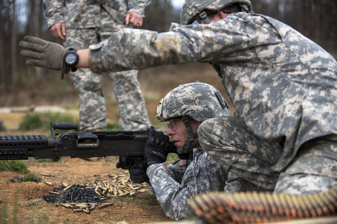 Army Sgt. Heath Wolfe shoots an M240B machine gun during a qualification range event on Camp Atterbury, Ind., Nov. 6, 2015. Wolfe is an Army Reserve military policeman assigned to the 384th Engineer Battalion. U.S. Army photo by Master Sgt. Michel Sauret