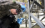 Airman 1st Class Steven Trottier, 51st Logistics Readiness Squadron fuels facility technician, analyzes a sample of JP-8 jet fuel taken from a filter separator at Osan Air Base, Republic of Korea, Oct. 15, 2015. Trottier checks to make sure the filters are doing their job of eliminating excess water and contaminants from the fuel. (U.S. Air Force photo/Staff Sgt. Amber Grimm)