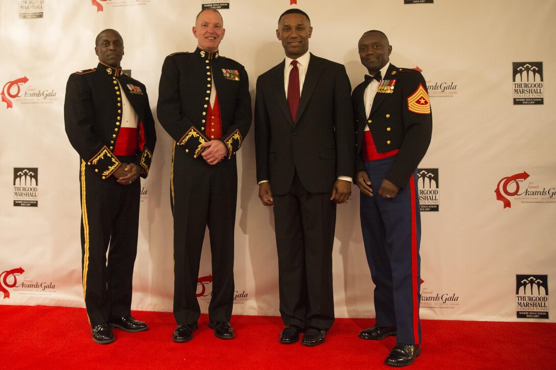 Lieutenant Colonel Brian Proctor (left), Lt. Gen. Mark A. Brilakis, Johnny C. Taylor Jr., and Sgt. Maj. Samuel Heyward Jr. meet during the 2015 Thurgood Marshall College Fund 27th annual Awards Gala in Washington D.C., Nov. 16. The ceremony is the culminating event of the TMCF Leadership Institute, a three day conference and career day for Historically Black Colleges and University students held in honor of civil rights activist Thurgood Marshall. Proctor currently serves as the Officer in Charge of Diversity with Marine Corps Recruiting Command aboard Marine Corps Base Quantico, Va. Brilakis currently serves as the Commanding General of MCRC. Taylor is the President and CEO of the TMCF. Heyward serves as the Sergeant Major of MCRC.