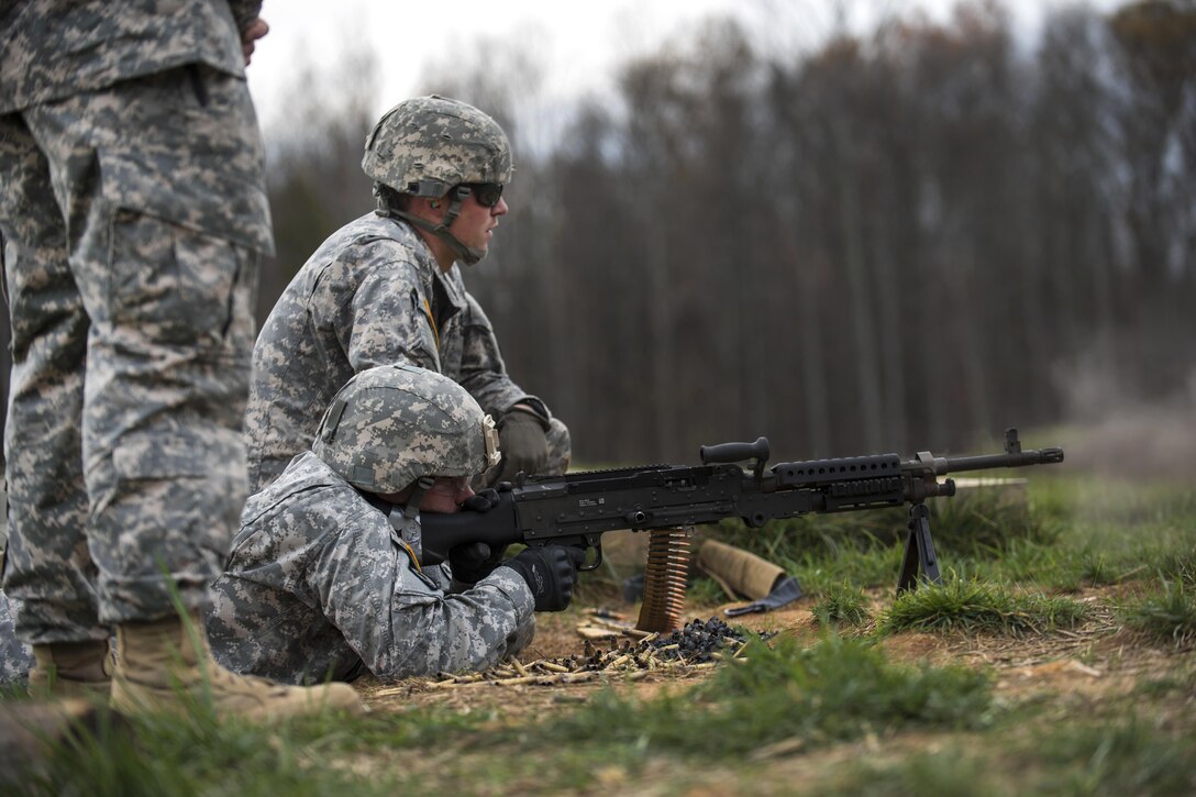 A soldier shoots an M240B machine gun on Camp Atterbury, Ind., Nov. 6, 2015. U.S. Army photo by Master Sgt. Michel Sauret
