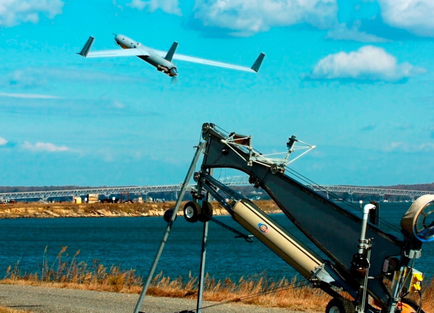 A Scan Eagle unmanned aerial vehicle launches from the Naval Surface Warfare Center Dahlgren Division (NSWCDD) Potomac River Test Range during a surface warfare integration test featuring the virtual USS Dahlgren. Scan Eagle identified, targeted, engaged and supported reengagement throughout the experiment as the NSWCDD-patented Visual Automatic Scoring System sent gun targeting corrections to the MK160 gun weapon system operator. "USS Dahlgren is empowering our integration of unmanned air and surface vehicles into the fire-control-loop for greatly expanded battle space and increased reaction times," said Neil Baron, NSWCDD distinguished scientist for combat control.   