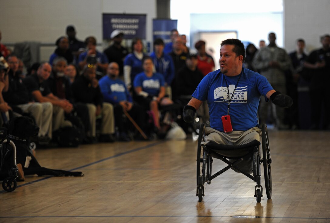 Bob Lujano, a Paralympic athlete, speaks to wounded warriors at the opening ceremonies of the Northeast Region Warrior CARE Event at Joint Base Andrews, Md., Nov. 16, 2015. The event is held in conjunction with Warrior Care Month, a month dedicated to honoring the courage, resilience and accomplishments of wounded, ill and injured service members, their families and their caregivers. (U.S. Air Force photo/Tech. Sgt. Brian Ferguson)