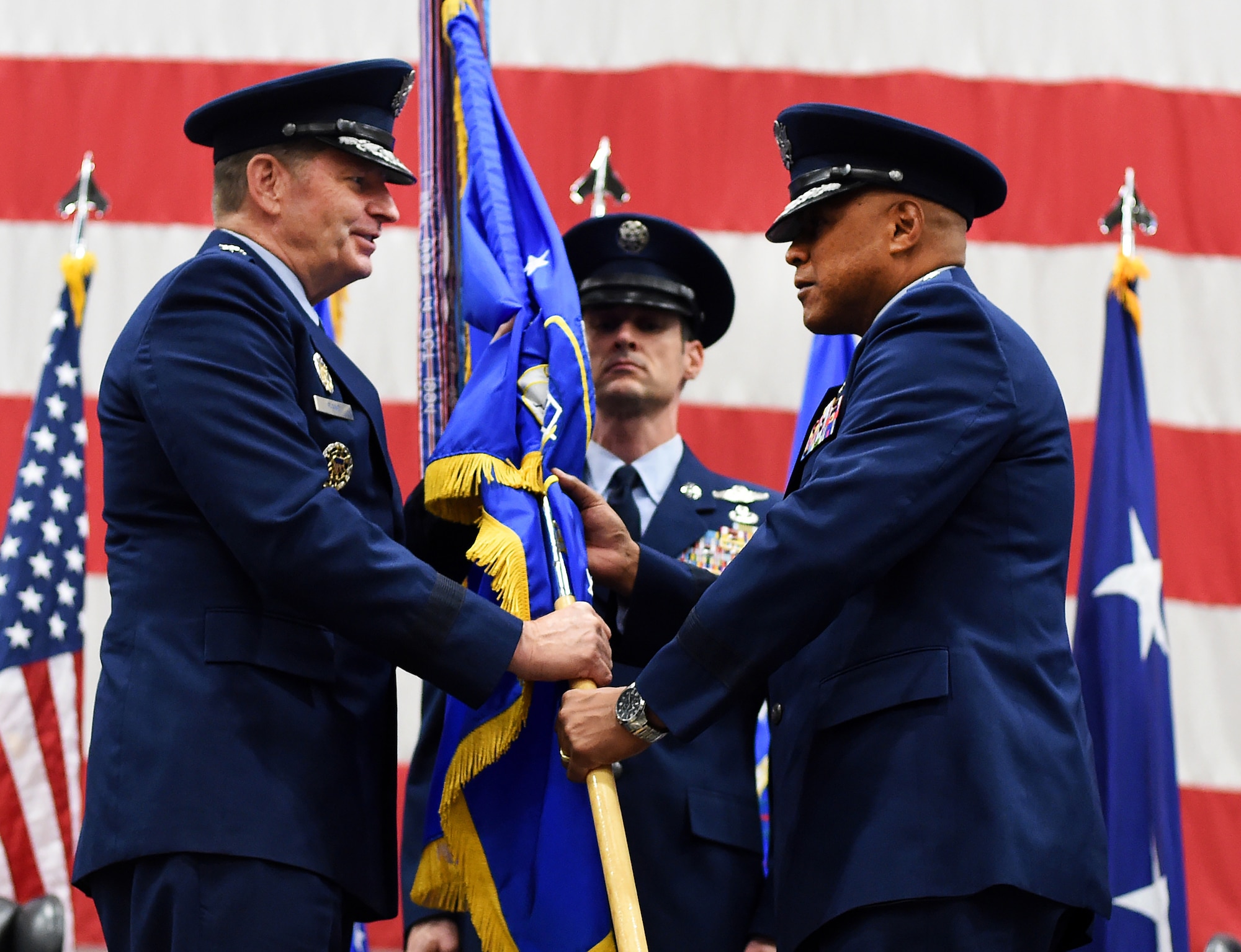 Gen. Robin Rand, Air Force Global Strike Command commander, presents the 20th Air Force guidon to Maj. Gen. Anthony J. Cotton at F.E. Warren Air Force Base, Wyo., Nov. 16, 2015, as Cotton takes command of the numbered air force responsible for the nation's three intercontinental ballistic missile wings and one nuclear operations support wing. Cotton also took command of Task Force 214 from Adm. Cecil D. Haney, U.S. Strategic Command commander, during the same ceremony.  Twentieth Air Force prepares the nation's ICBM forces to execute safe, secure and effective nuclear strike operations and supports worldwide combatant commander requirements. (U.S. Air Force photo by R.J. Oriez)