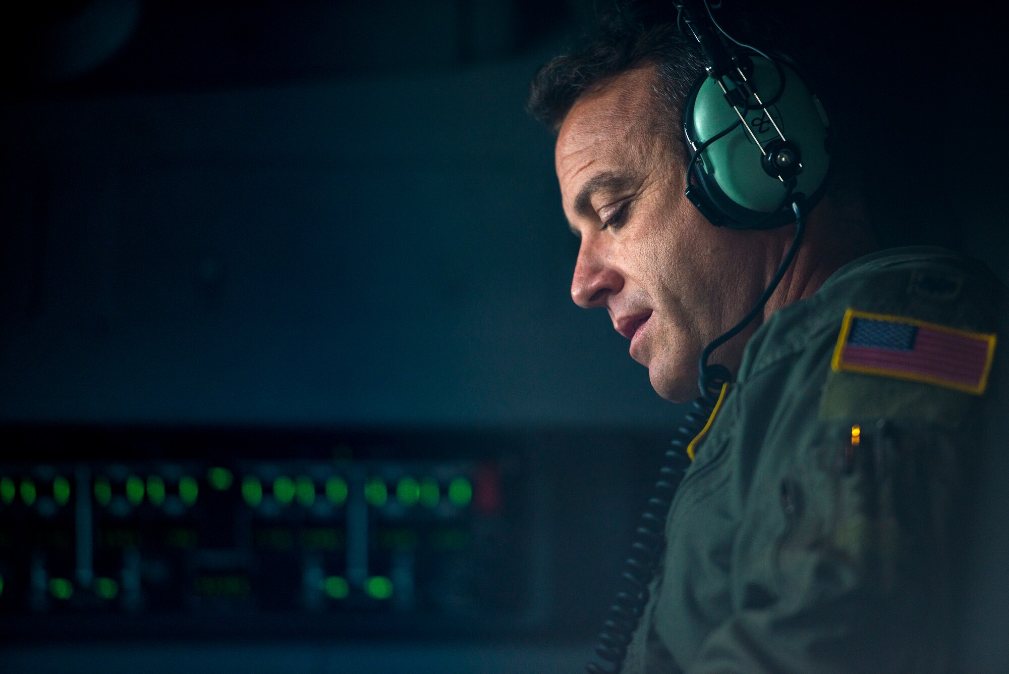 U.S. Air Force Lt. Col. Matthew Leddy, 71st Rescue Squadron HC-130J Combat King II pilot, scans pre-flight checklists, Nov. 10, 2015, at Moody Air Force Base, Ga. Airmen from the 71st RQS must be constantly ready to respond to natural disasters and isolated personnel. (U.S. Air Force photo by Senior Airman Ryan Callaghan/Released)

