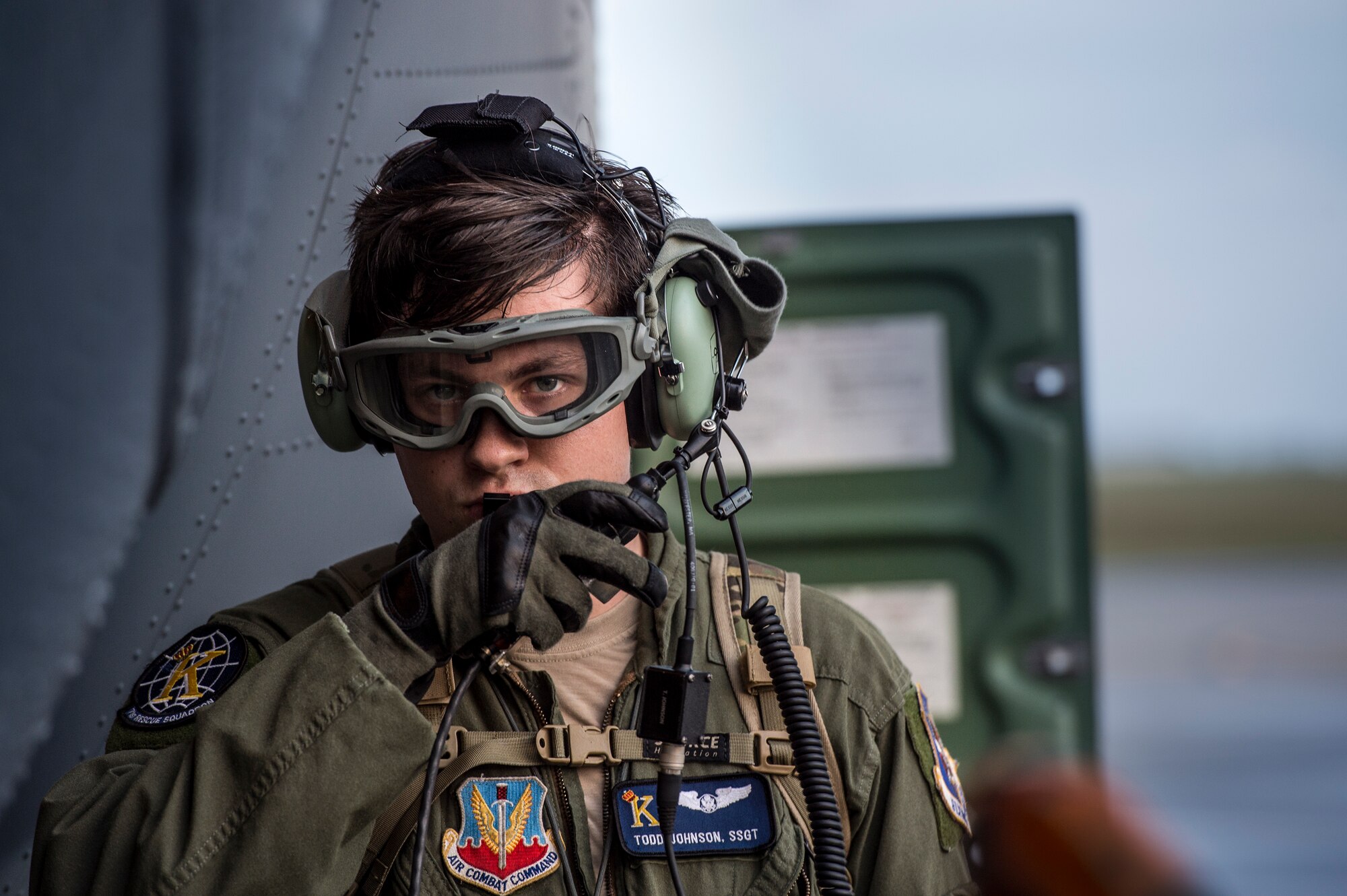 U.S. Air Force Staff Sgt. Todd Johnson, 71st Rescue Squadron loadmaster, communicates with the aircrew members onboard an HC-130J Combat King II during aircraft refueling, Nov. 3, 2015, at Moody Air Force Base, Ga. In addition to refueling operations, some of the tasks loadmasters are responsible for include: calculating aircraft weight, balance records and cargo manifest, conducting cargo and personnel airdrops, and troubleshooting in-flight problems. (U.S. Air Force photo by Senior Airman Ryan Callaghan/Released)
