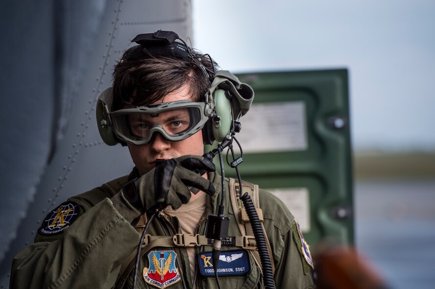 U.S. Air Force Staff Sgt. Todd Johnson, 71st Rescue Squadron loadmaster, communicates with the aircrew members onboard an HC-130J Combat King II during aircraft refueling, Nov. 3, 2015, at Moody Air Force Base, Ga. In addition to refueling operations, some of the tasks loadmasters are responsible for include: calculating aircraft weight, balance records and cargo manifest, conducting cargo and personnel airdrops, and troubleshooting in-flight problems. (U.S. Air Force photo by Senior Airman Ryan Callaghan/Released)

