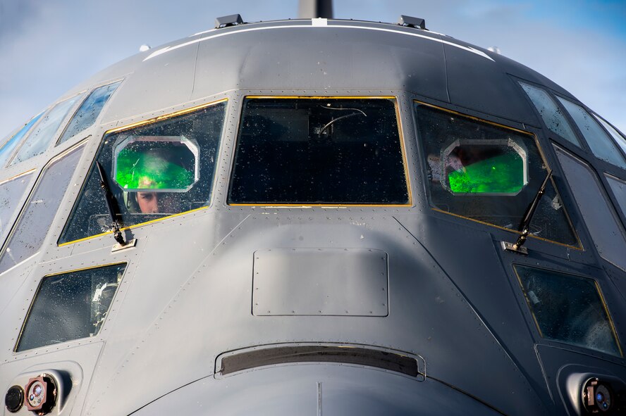 U.S. Air Force Staff Sgt. Jacob Dattage, 71st Rescue Squadron loadmaster, performs pre-flight checks in the cockpit of an HC-130J Combat King II, Nov. 3, 2015, at Moody Air Force Base, Ga. As a loadmaster, Dattage is responsible for ensuring the aircraft is prepared for a safe take off. (U.S. Air Force photo by Senior Airman Ryan Callaghan/Released)
