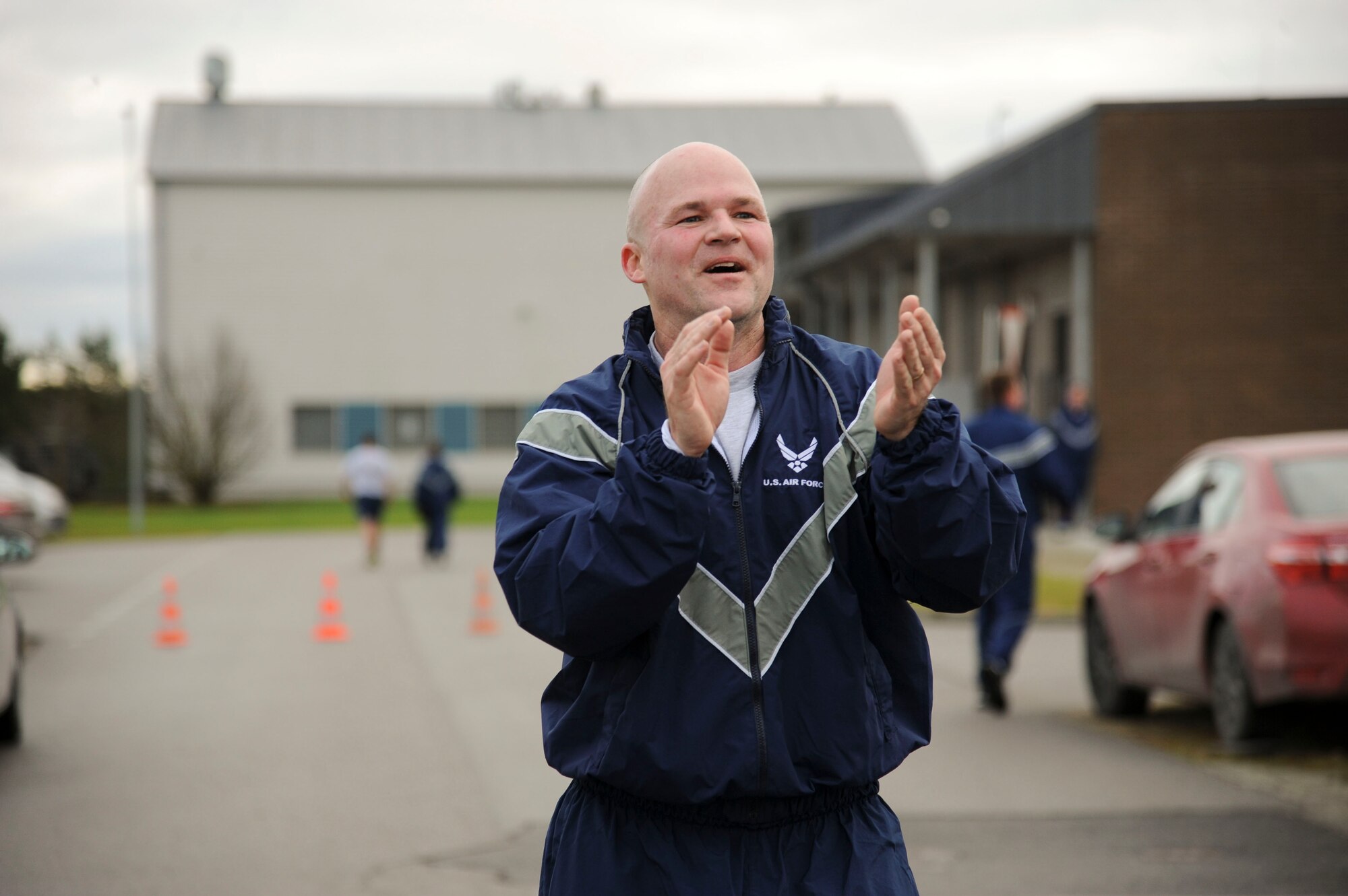 U.S. Air Force Lt. Col. Bryan France, 74th Expeditionary Fighter Squadron commander, motivates Airmen approaching the finish line during the annual Run for Veteran’s 4.5K fun run at  Amari Air Base, Estonia Nov. 13, 2015. France, an Alabama native, is deployed from Moody Air Force Base, Ga., as part of a theater security package in support of Operation Atlantic Resolve. (U.S. Air Force photo by Andrea Jenkins/Released)
