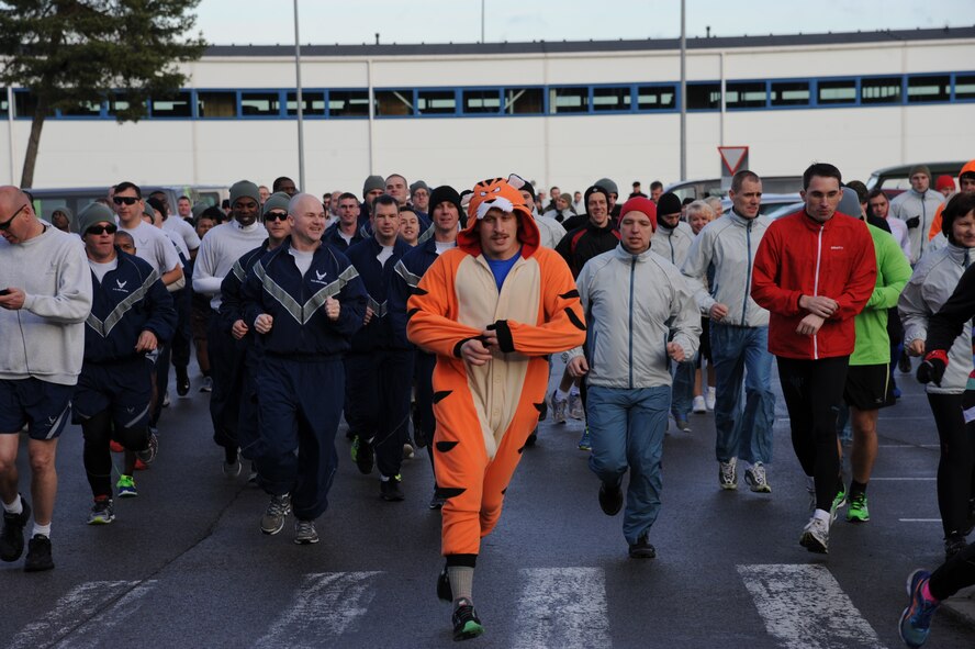 U.S. Air Force Capt. Joseph Stafford, 74th Expeditionary Fighter Squadron A-10 pilot, leads runners across the starting line wearing a tiger costume during the annual Run for Veteran’s 4.5K fun run at Amari Air Base, Estonia Nov. 13, 2015. Stafford is deployed from Moody Air Force Base, Ga., as part of a theater security package in support of Operation Atlantic Resolve. (U.S. Air Force photo by Andrea Jenkins/Released)
