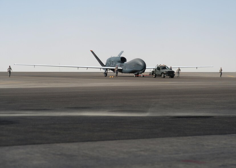 Airmen assigned to the 380th Expeditionary Aircraft Maintenance Squadron recover an EQ-4 Global Hawk at an undisclosed location in Southwest Asia Nov. 11, 2015. The Global Hawk nicknamed the “workhorse” by local maintainers, completed its 500th sortie on Veterans Day. (U.S. Air Force photo/Tech. Sgt. Frank Miller)
