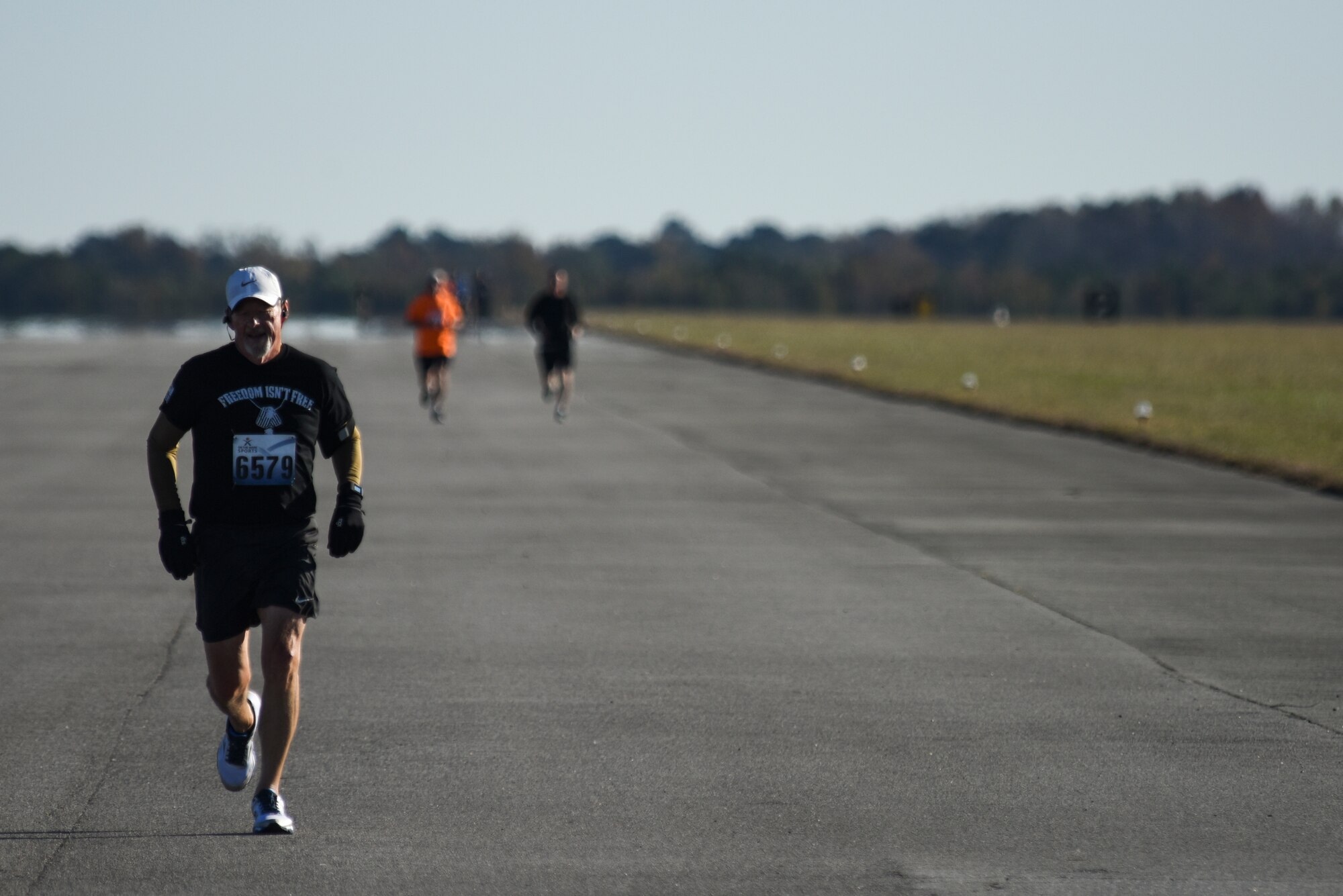 Michael Arnold reaches the 6-mile mark of the Run for the Fallen Half-Marathon, Nov. 14, 2015, at Seymour Johnson Air Force Base, North Carolina. Arnold placed second in his age division and fifth overall with a time of 1 hour, 43 minutes, 27 seconds. (U.S. Air Force photo/Senior Airman Brittain Crolley)