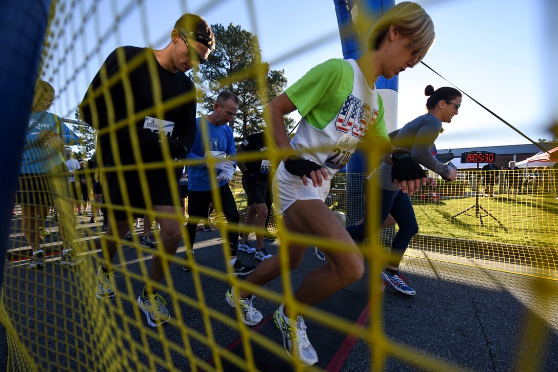 Half-marathon runners take off during the Run for the Fallen Half-Marathon/5K, Nov. 14, 2015, at Seymour Johnson Air Force Base, North Carolina. More than 200 runners participated in the event in honor of fallen service members. (U.S. Air Force photo/Senior Airman Brittain Crolley)