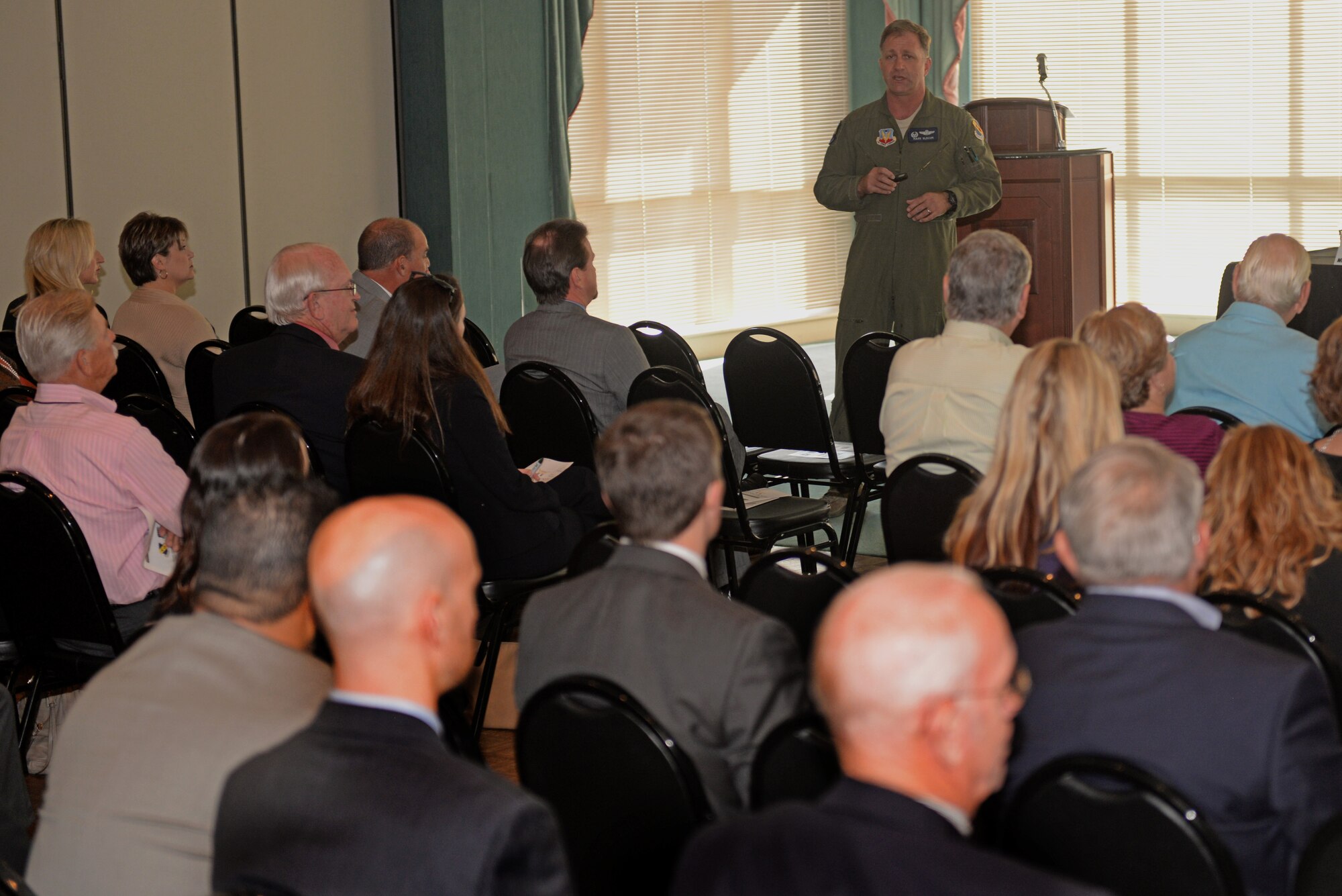 Col. Mark Slocum, 4th Fighter Wing commander, speaks to the community about current base projects during the Wayne County Chamber of Commerce State of the Military Briefing, Nov. 12, 2015, at Lane Tree Golf Club in Goldsboro, North Carolina. Slocum discussed how the Make It Better program is getting Team Seymour Airmen to take leadership roles, spearhead new clubs for the base and get the Airmen more involved within the base and community. (U.S. Air Force photo/Airman 1st Class Ashley Williamson)