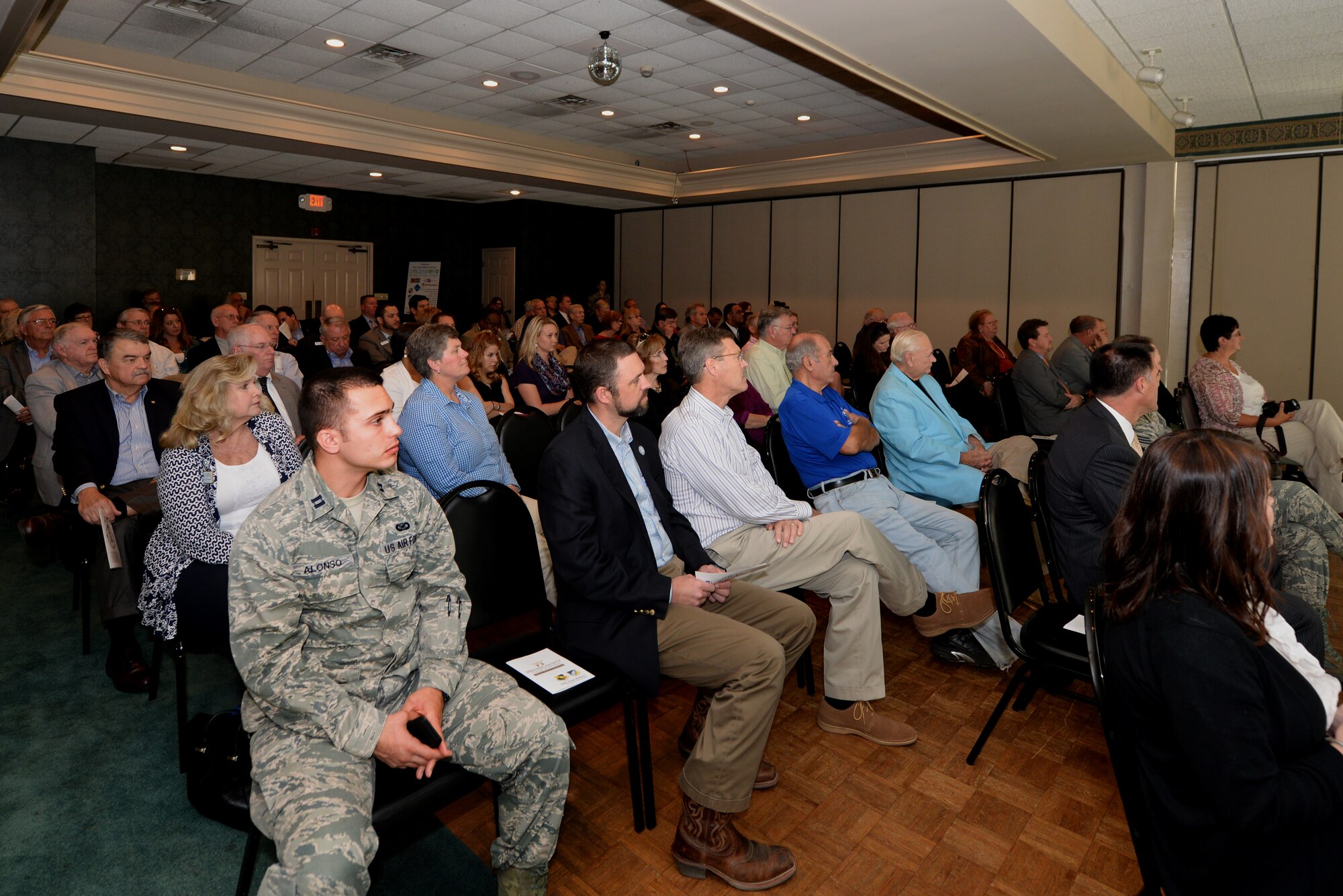Members of Team Seymour and the local community listen to the Wayne County Chamber of Commerce State of the Military Briefing, Nov. 12, 2015, at Lane Tree Golf Club in Goldsboro, North Carolina. The brief covered base happenings, base and community coordination and benefits as well as the importance of support for Seymour Johnson Air Force Base. (U.S. Air Force photo/Airman 1st Class Ashley Williamson)