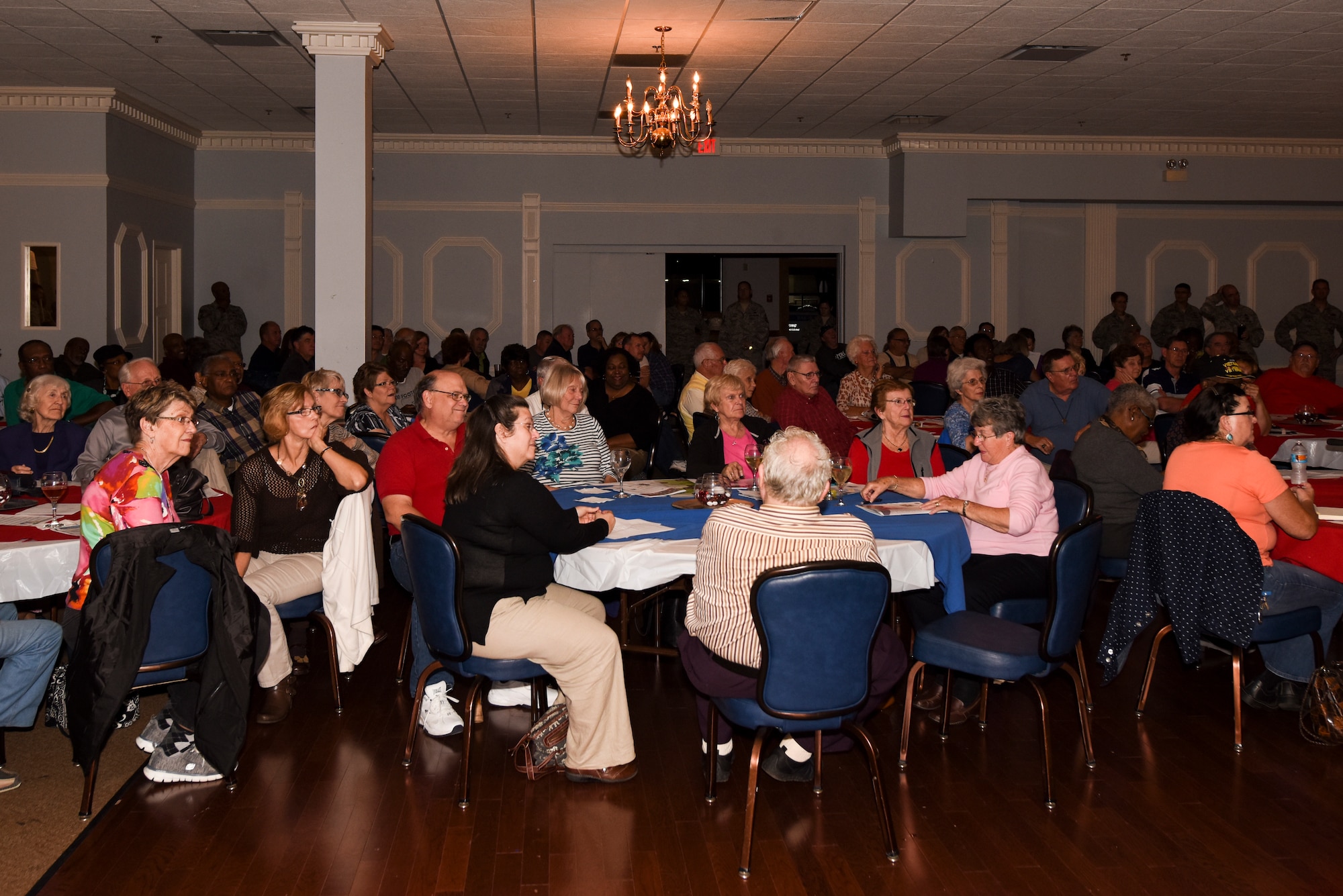 Retirees and volunteers gather together during a Retiree Appreciation Night event, Nov. 12, 2015, at Seymour Johnson Air Force Base, North Carolina. The event was the first under the new Make It Better for Retirees initiative, which aims to improve the quality of life on base for retired service members and their families. (U.S. Air Force photo/Airman Shawna L. Keyes)