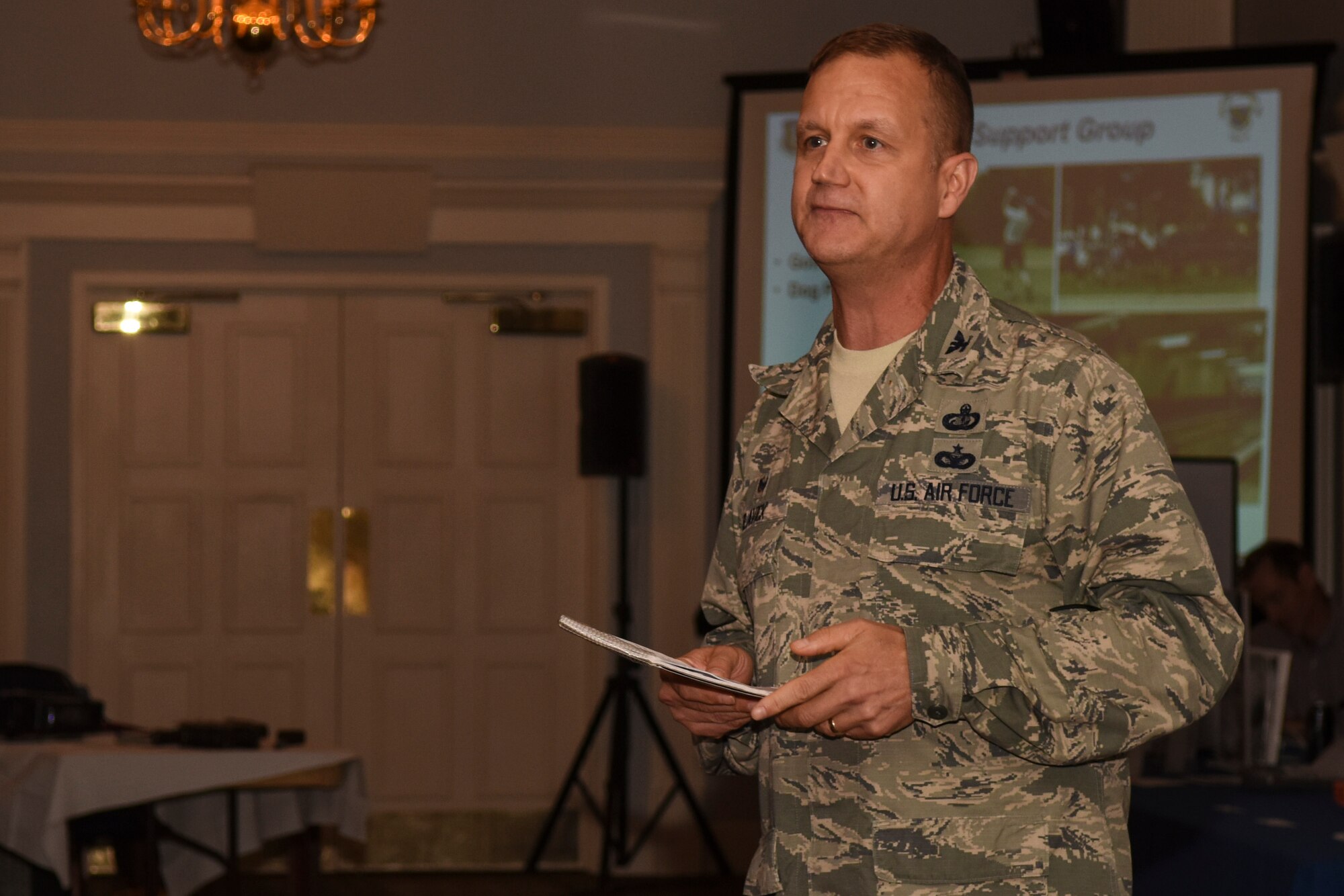 Col. Joe Slavick, 4th Mission Support Group commander, speaks during the Retiree Appreciation Night event, Nov. 12, 2015, at Seymour Johnson Air Force Base, North Carolina. Slavick highlighted the programs and facilities that both the group and its ancillary squadrons have available for retirees and their families. (U.S. Air Force photo/Airman Shawna L. Keyes)