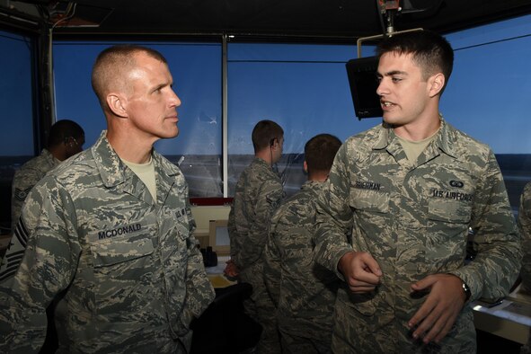 Chief Master Sgt. Steve McDonald (left), Air Combat Command command chief, speaks with Airman 1st Class David Frierman, 4th Operations Support Squadron air traffic controller, Nov. 12, 2015, at Seymour Johnson Air Force Base, North Carolina. In addition to the air traffic control tower, McDonald visited the 4th Security Forces Squadron shoot house and the 4th Civil Engineer Squadron explosive ordnance disposal range. (U.S. Air Force photo/Senior Airman Aaron J. Jenne)