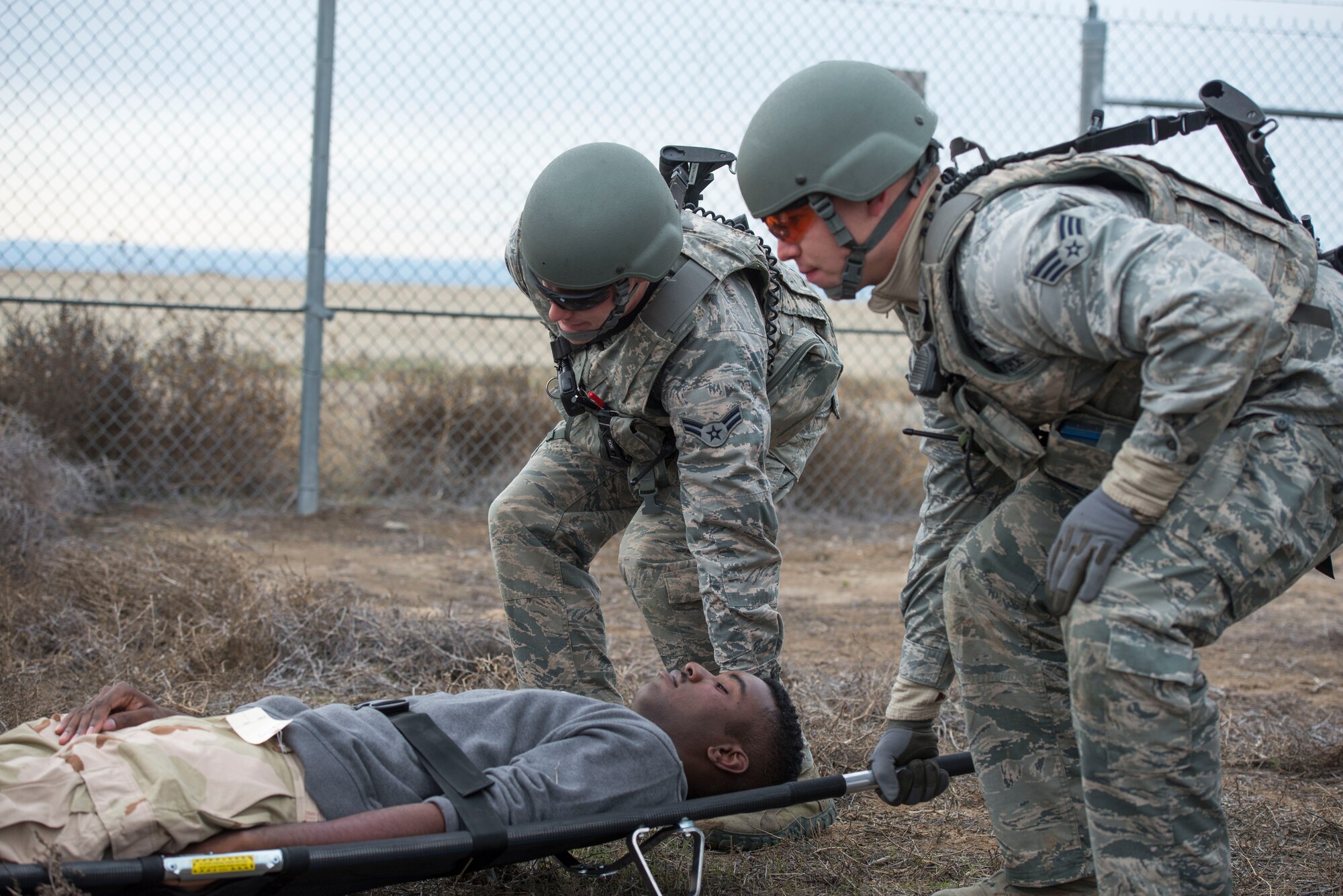 Members of the 366th Security Forces Squadron lift a stretcher with a simulated vehicle rollover victim during Gunfighter Flag 16-1 Nov. 6, 2015, at Mountain Home Air Force Base, Idaho. With SFS members usually being first responders, they often perform self-aid and buddy care in critical situations. (U.S. Air Force photo by Airman Chester Mientkiewicz)